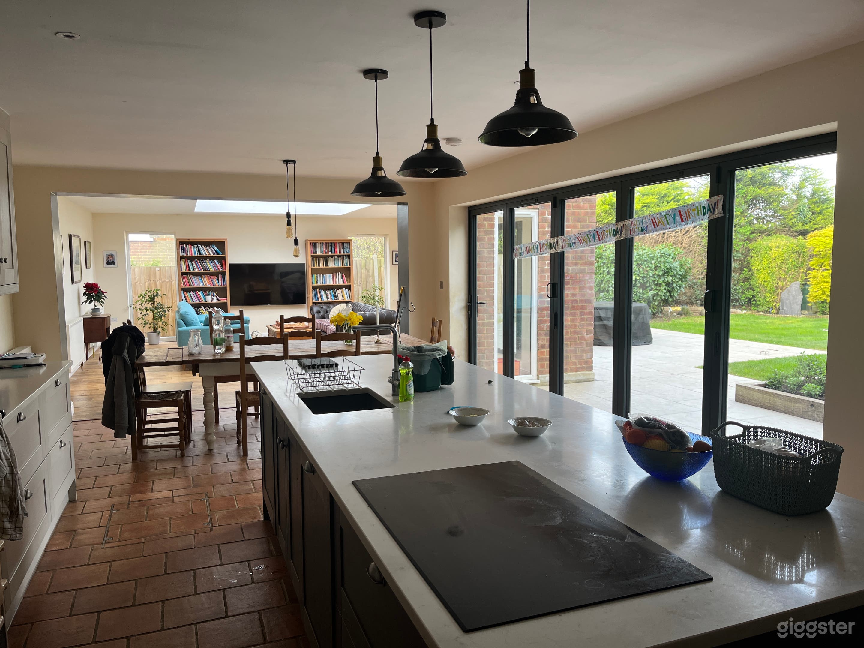 50 foot kitchen/living room with 2 sets of bifolds and 16 foot skylight