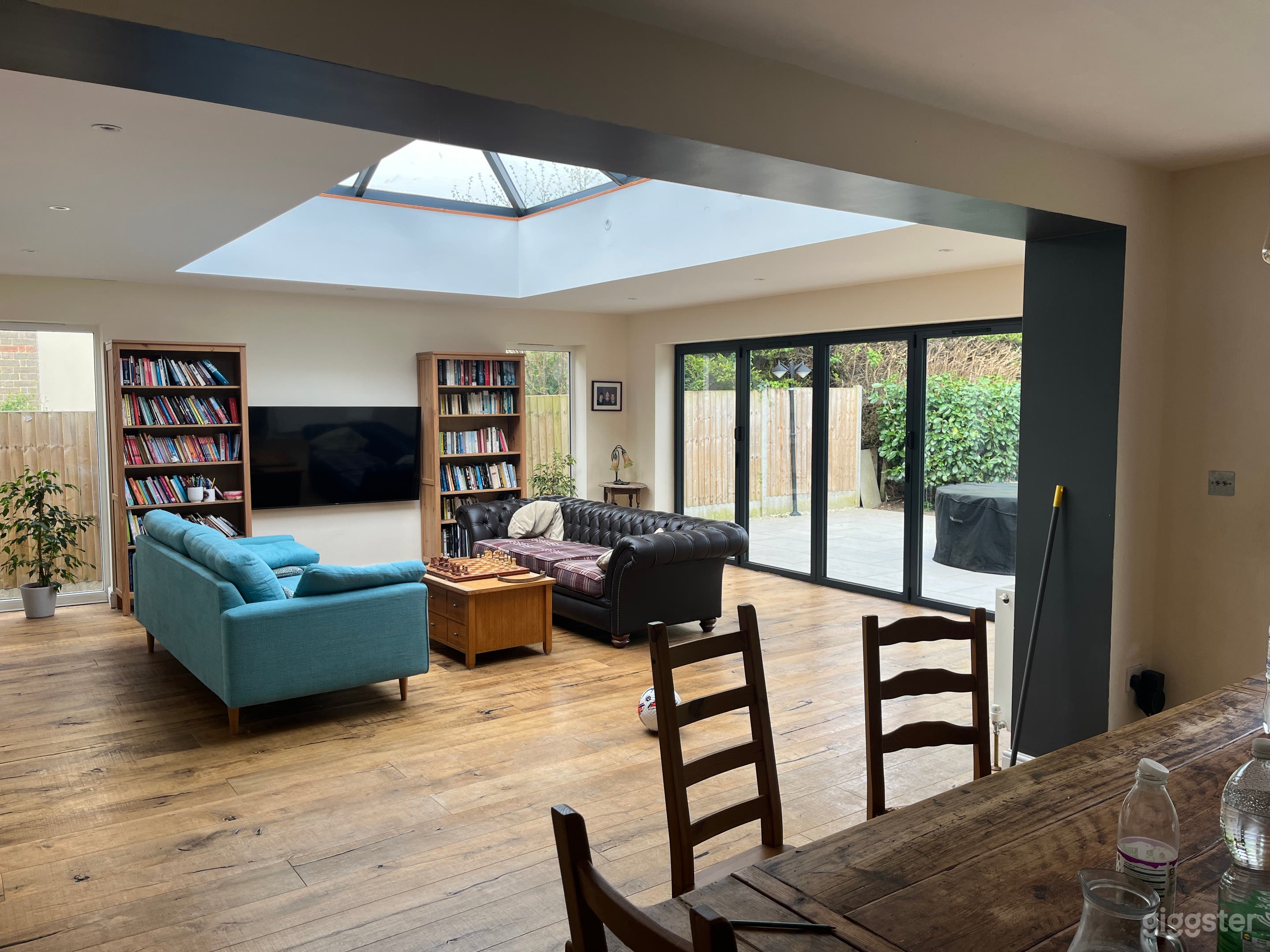 Open plan living room with 16 foot skylight 