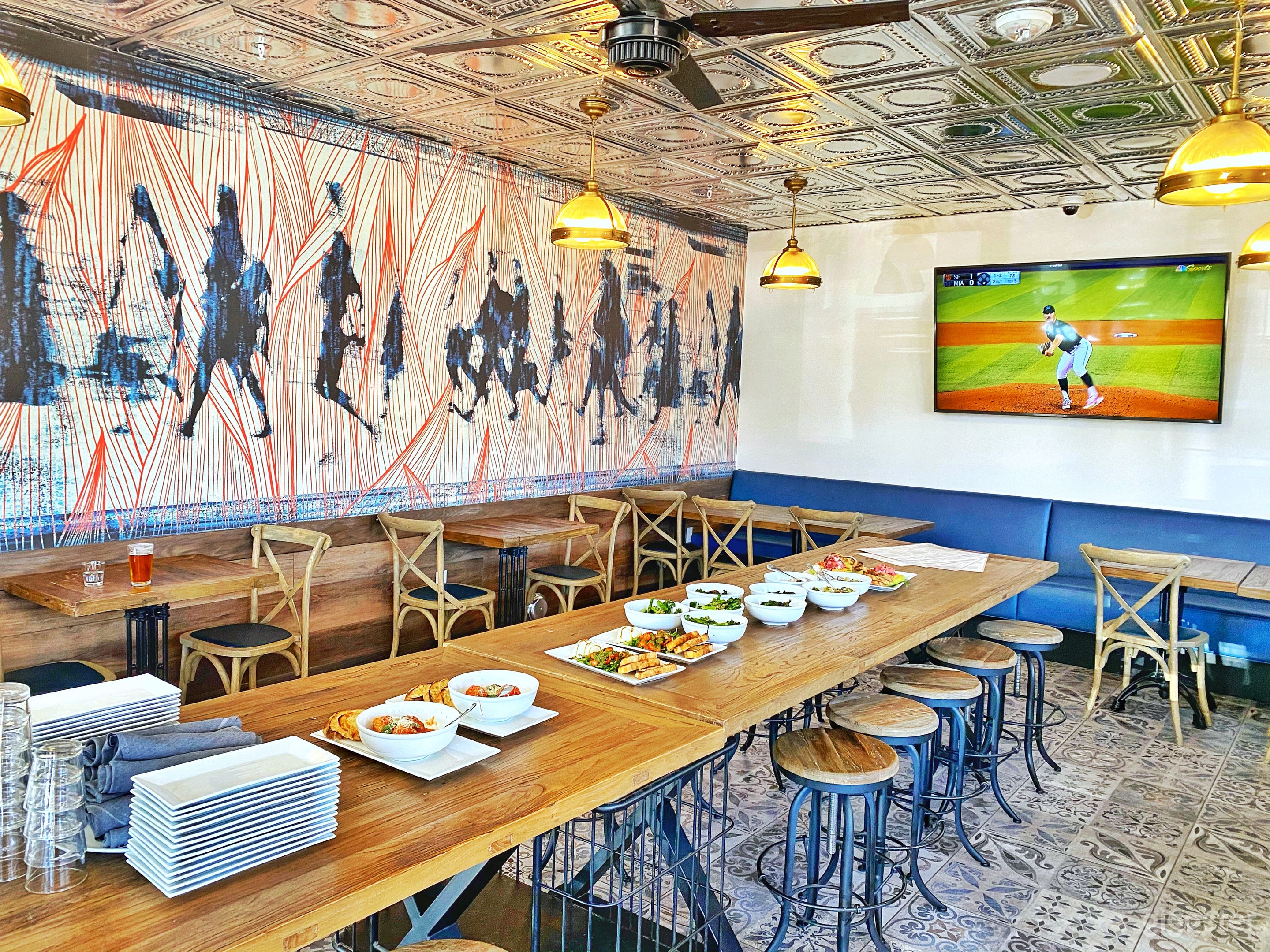 Our special Train Car Room was designed to resemble dining train cars of the past. Feel free to admire the beautiful artwork on our wall. We selected this particular piece because of the movement it conveys and the color combination is a perfect expression