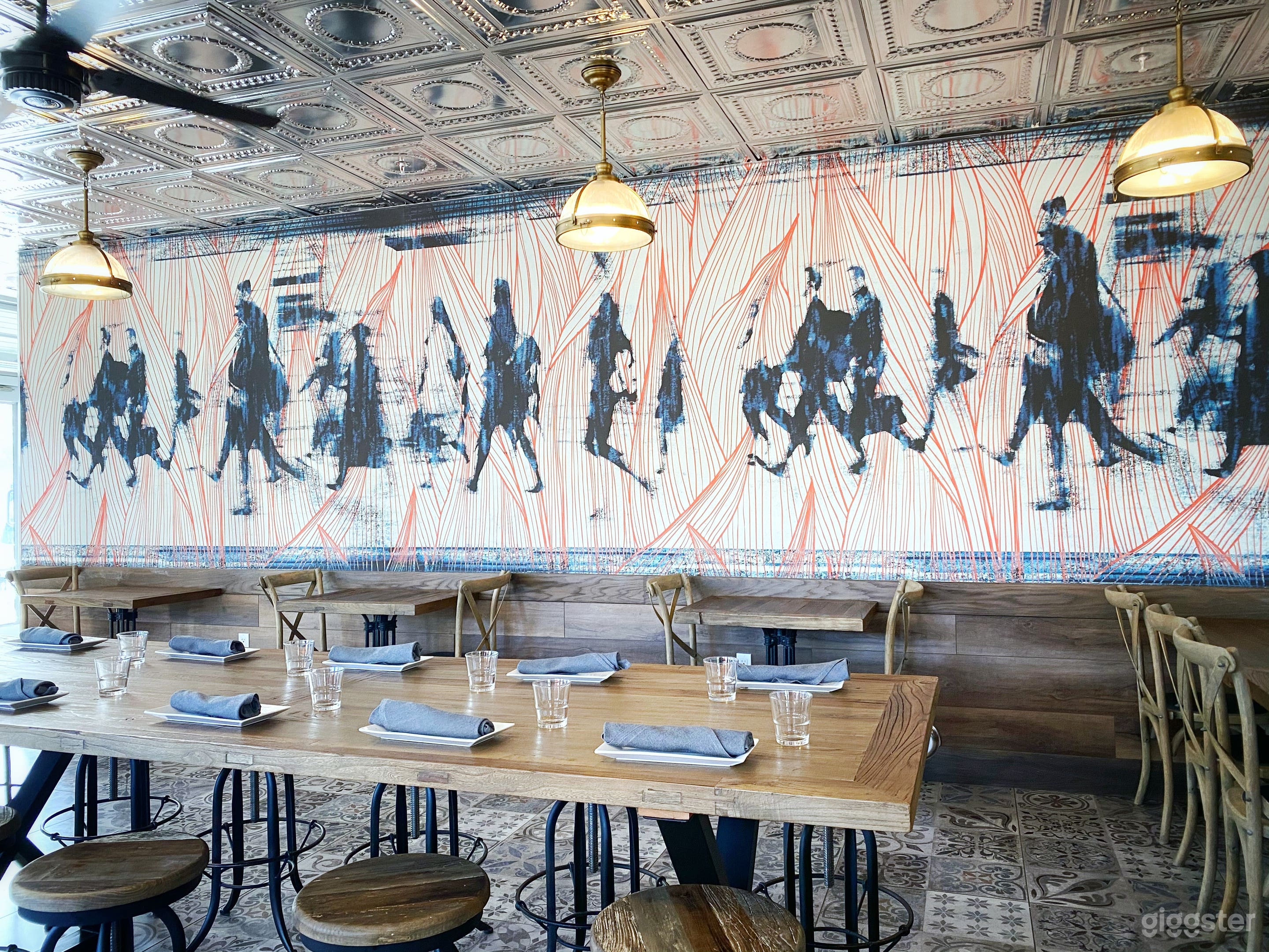 Our special Train Car Room was designed to resemble dining train cars of the past. Feel free to admire the beautiful artwork on our wall. We selected this particular piece because of the movement it conveys and the color combination is a perfect expression