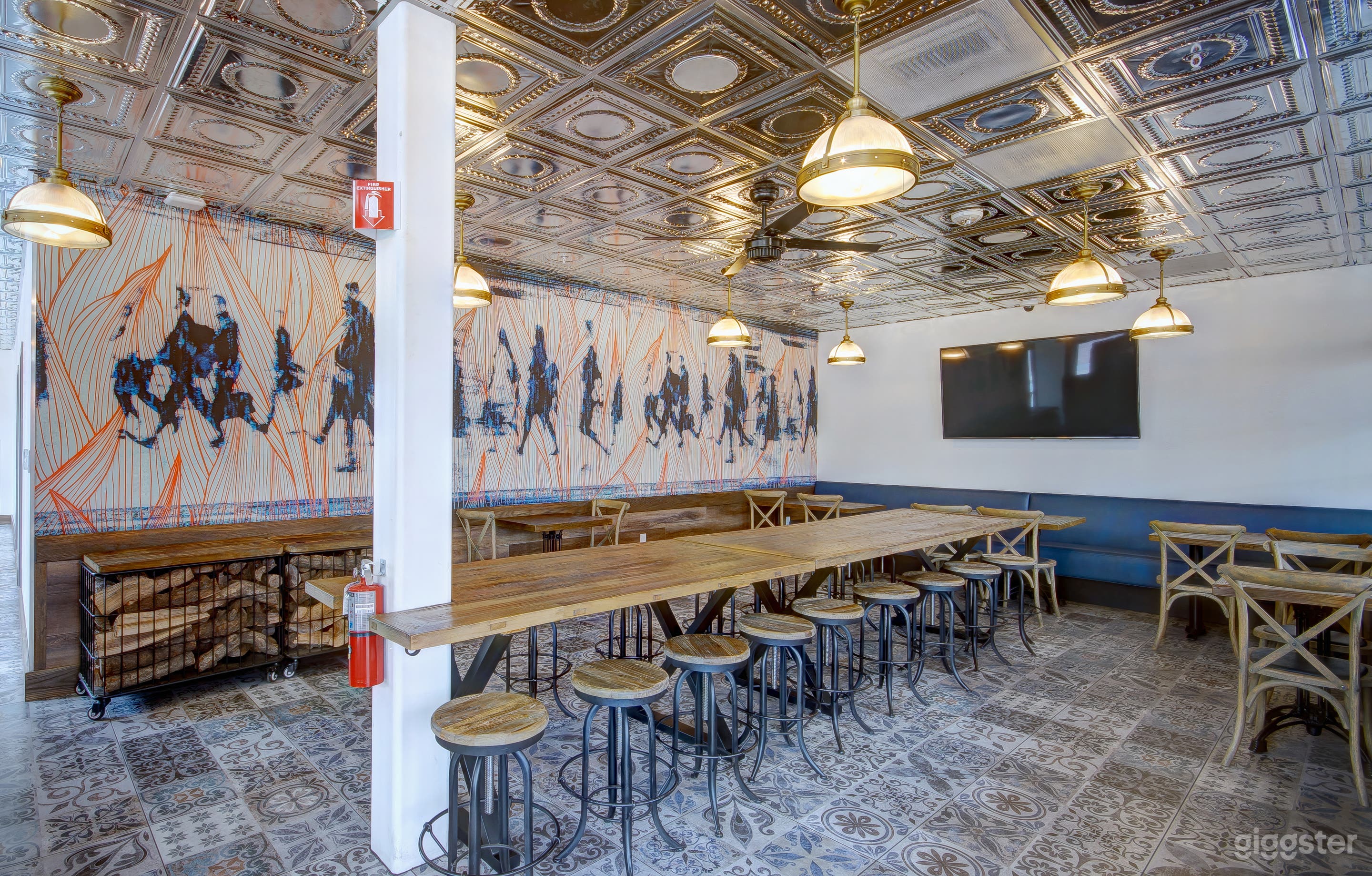 Our special Train Car Room was designed to resemble dining train cars of the past. Feel free to admire the beautiful artwork on our wall. We selected this particular piece because of the movement it conveys and the color combination is a perfect expression