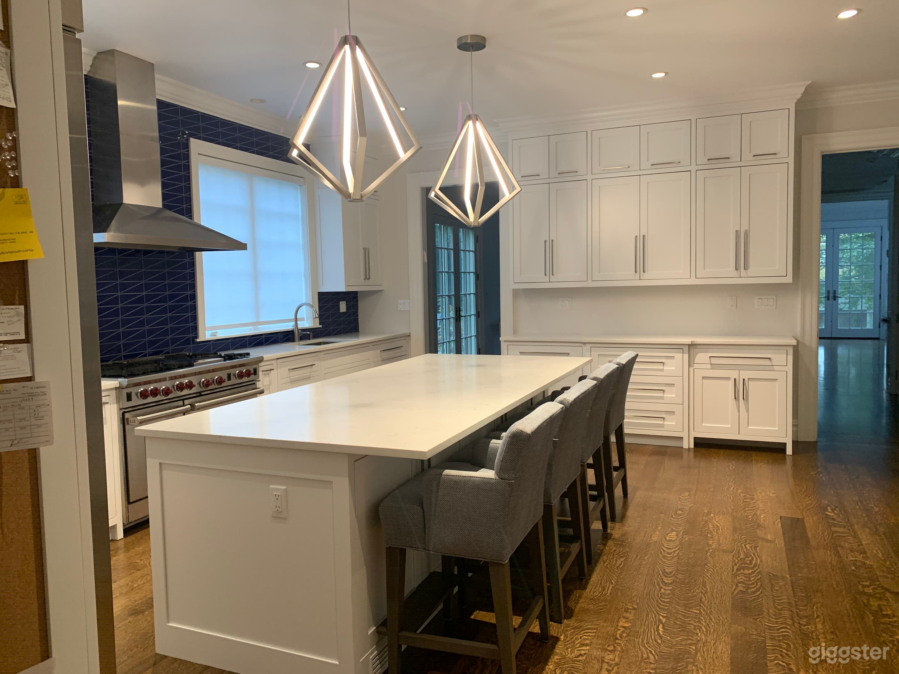Eat-in kitchen with modern blue backsplash