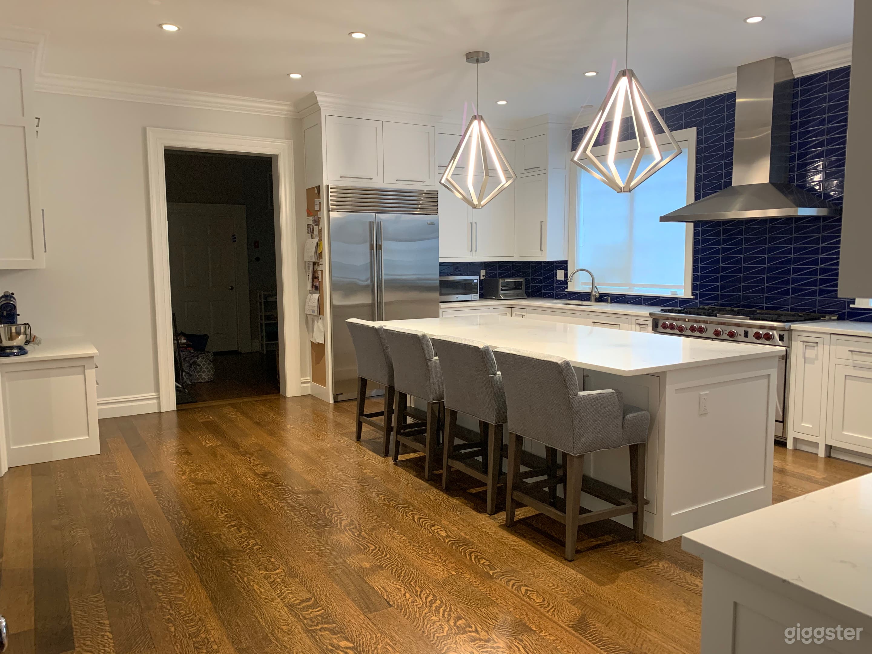 Alternate view of kitchen. Doorway leads to pantry and mudroom/garage entrance.