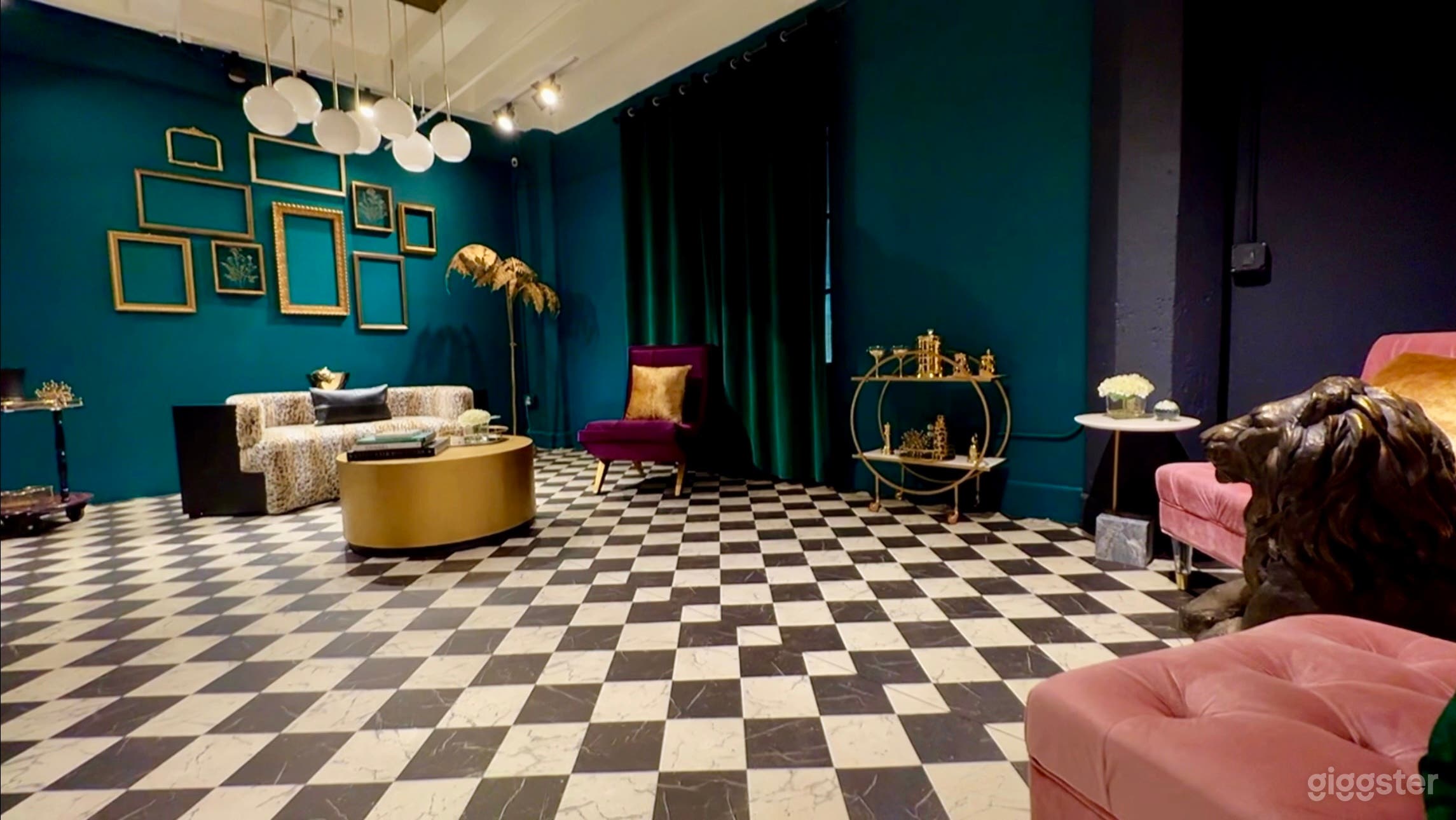 POSH DECO ROOM: Chic, sophisticated with a touch of glam, this is our largest room. Key features include beautiful green walls, a sophisticated dark grey wall, a diamond checkered floor, a modular leopard sofa, velvet accent furniture, and gold accents.