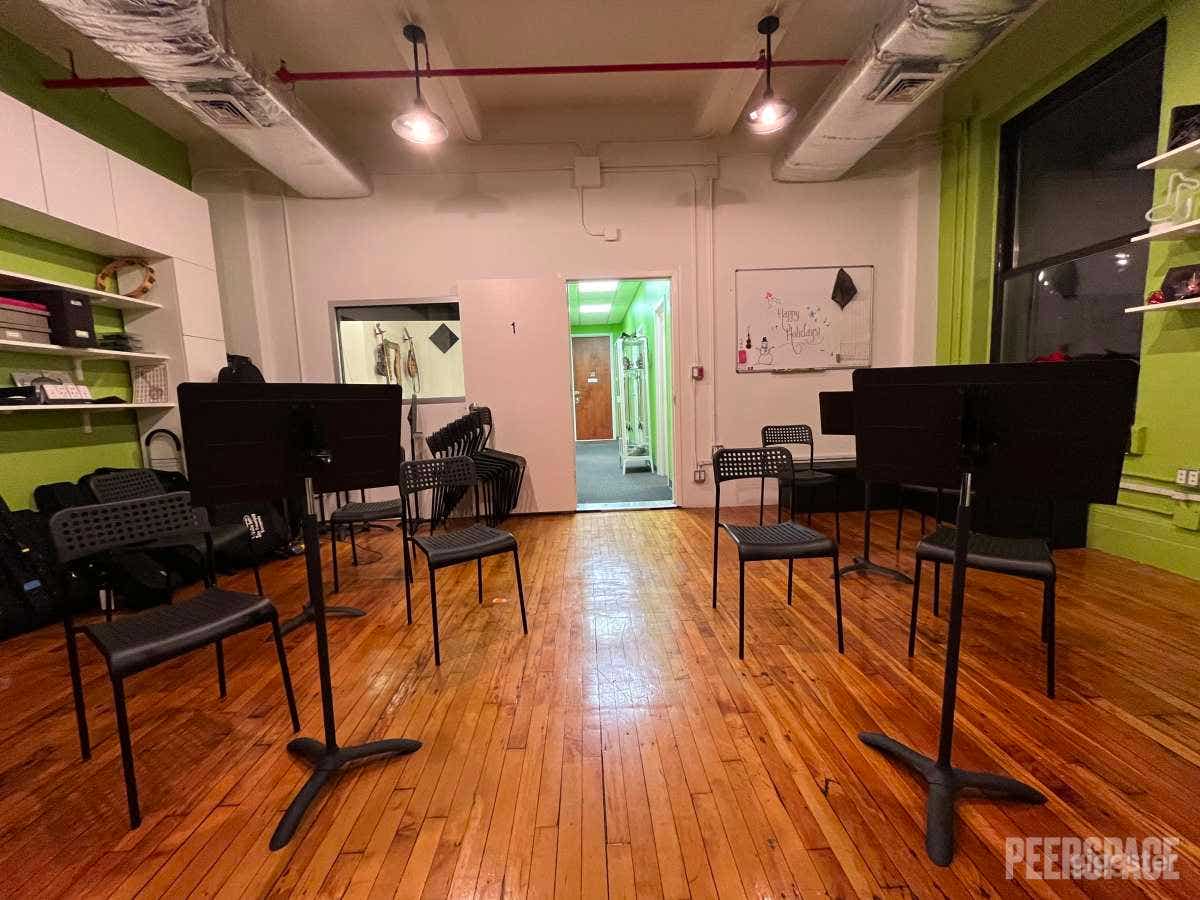 Large Room with spaced out chairs and music stands - perfect for rehearsals!