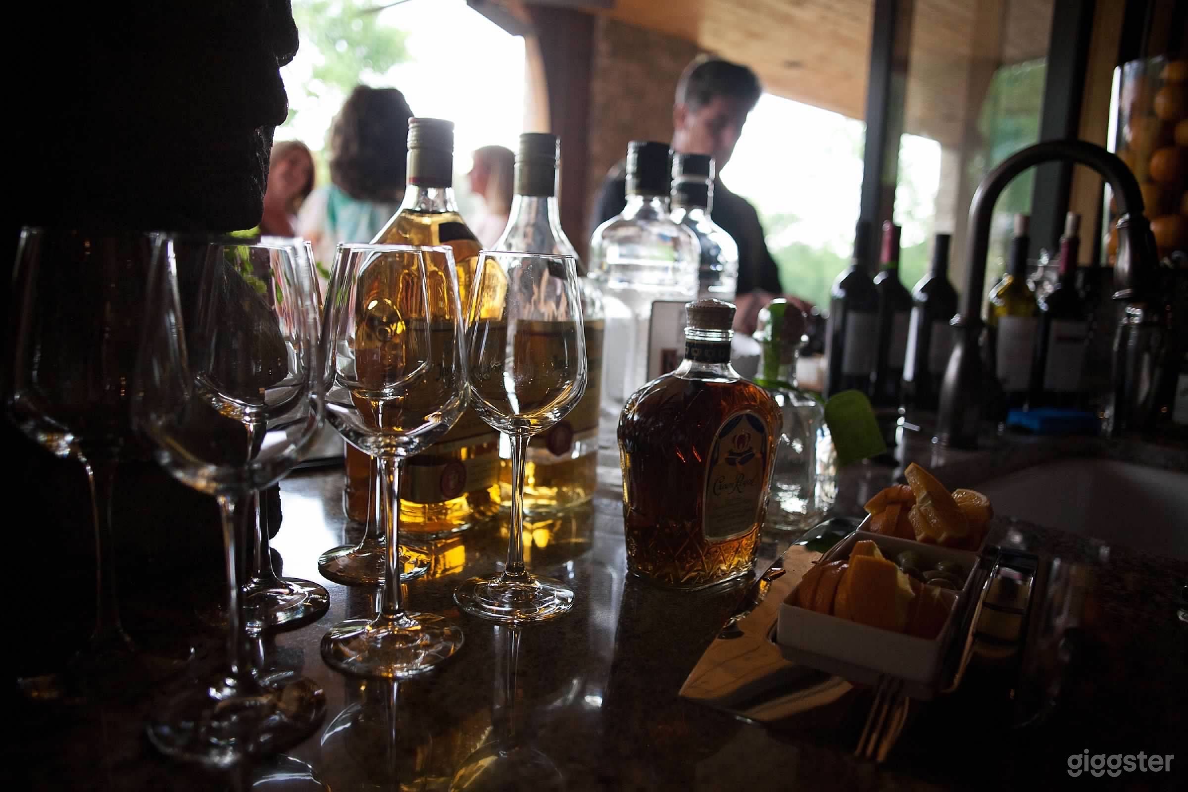 Lower Level Indoor/Outdoor Bar with Nana Door Pass Thru, Dishwasher, Icemaker and Refrigerator