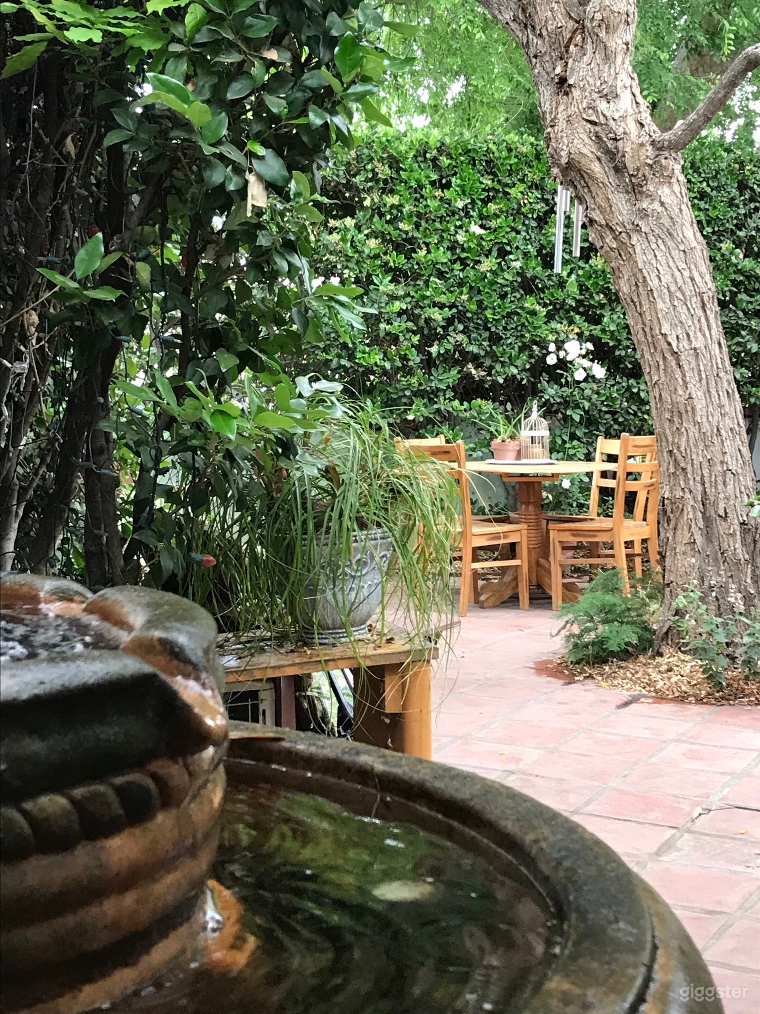 Patio includes an antique terra-cotta waterfall.