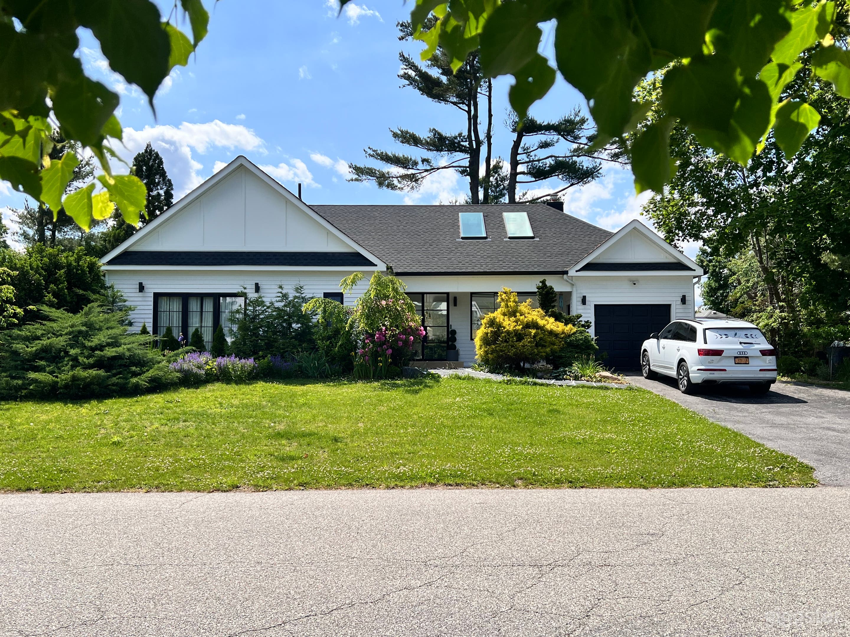 Green-River Double-Waterfall Island Luxury Skylit Kitchen Photo 1