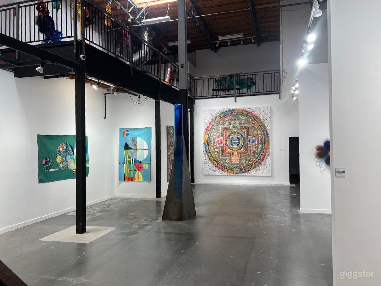 Main floor room functions as both an artist gallery, but can also be converted to host photo shots or other functions.  A versatile space