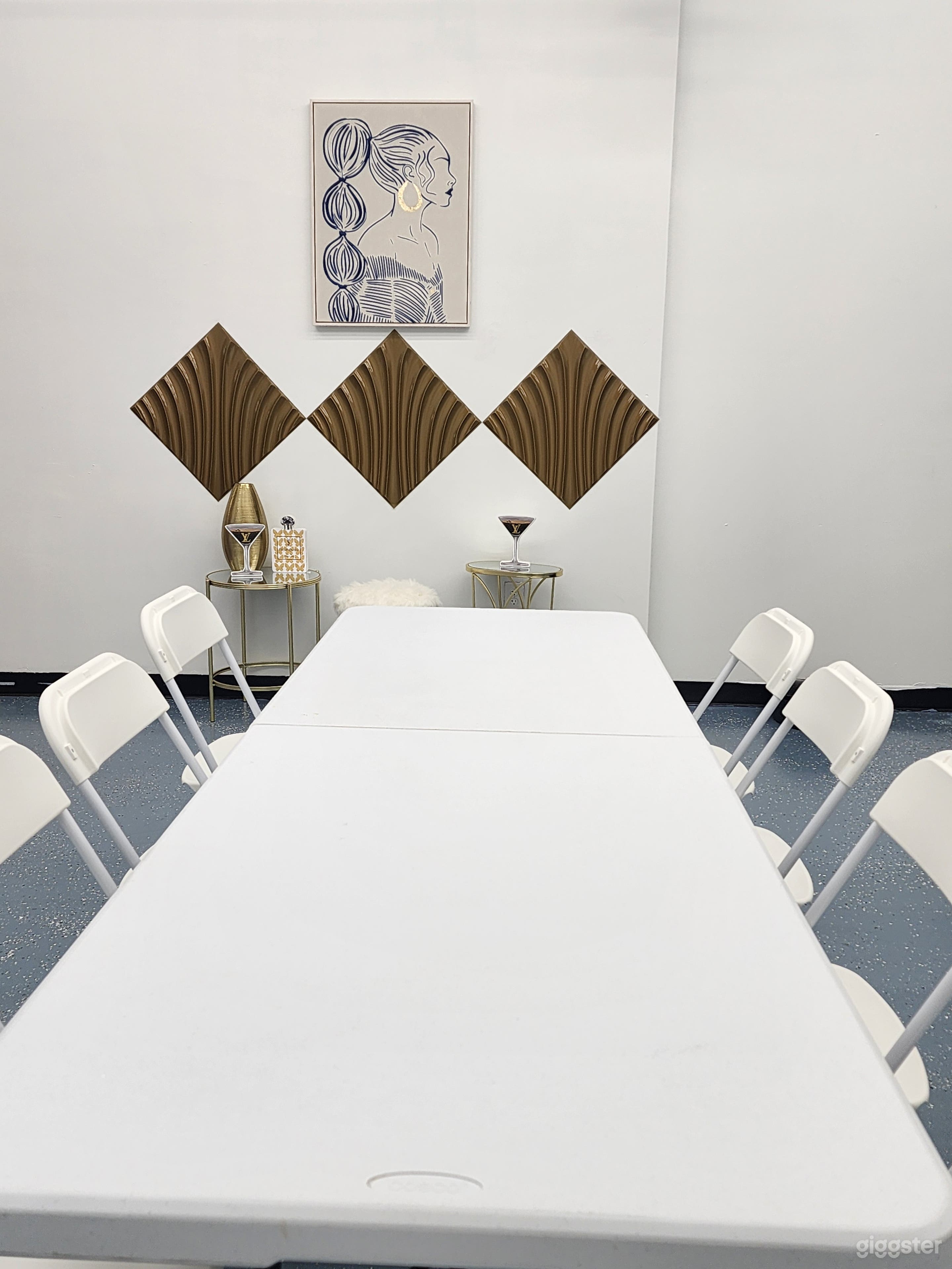 2 rooms. Dressing room, racks, white walls.