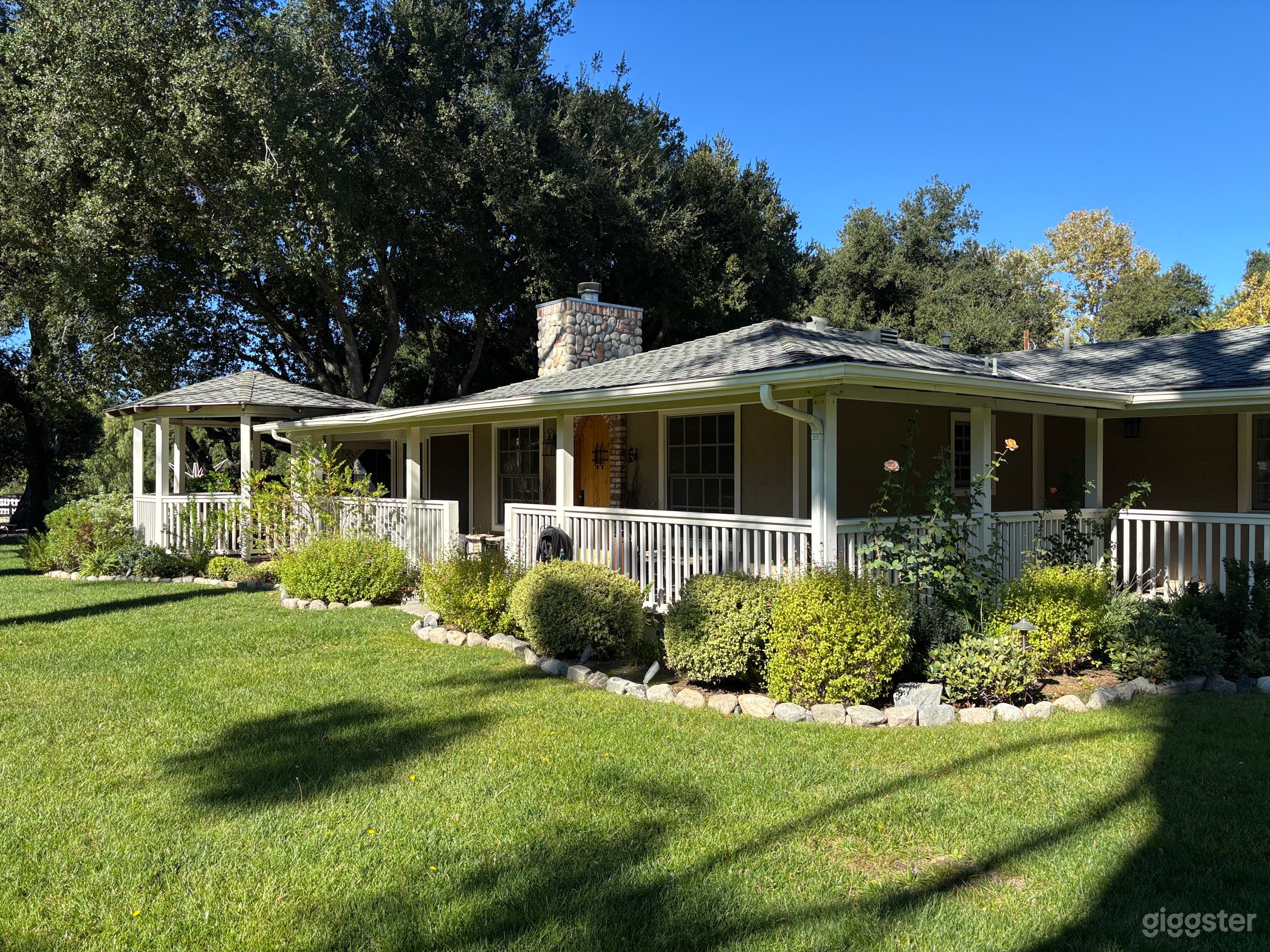 Ranch style facade with wrap around terrace and gazebo