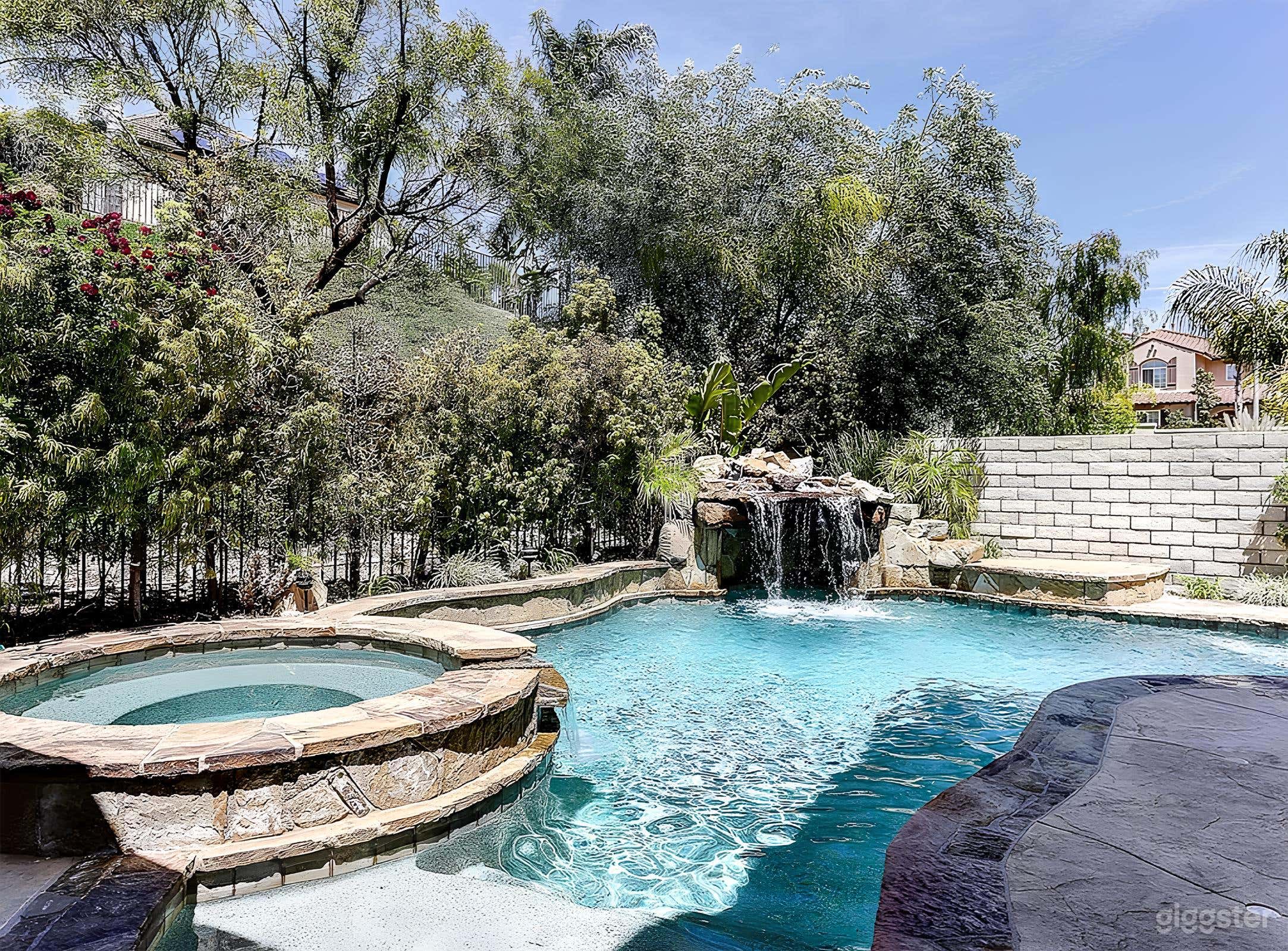 Tropical Backyard with Pool, Waterfall &amp; Outdoor Lounge Photo 3