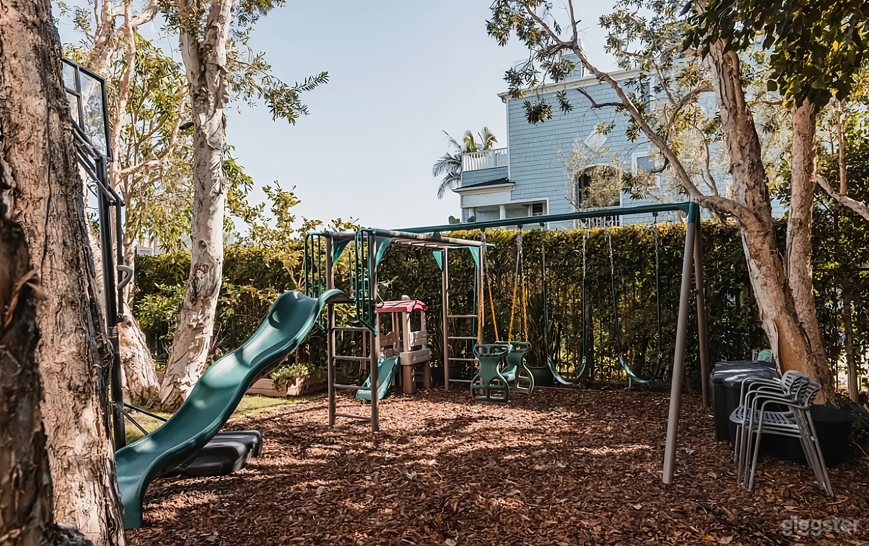 Modern Backyard Oasis with Play Area Photo 1