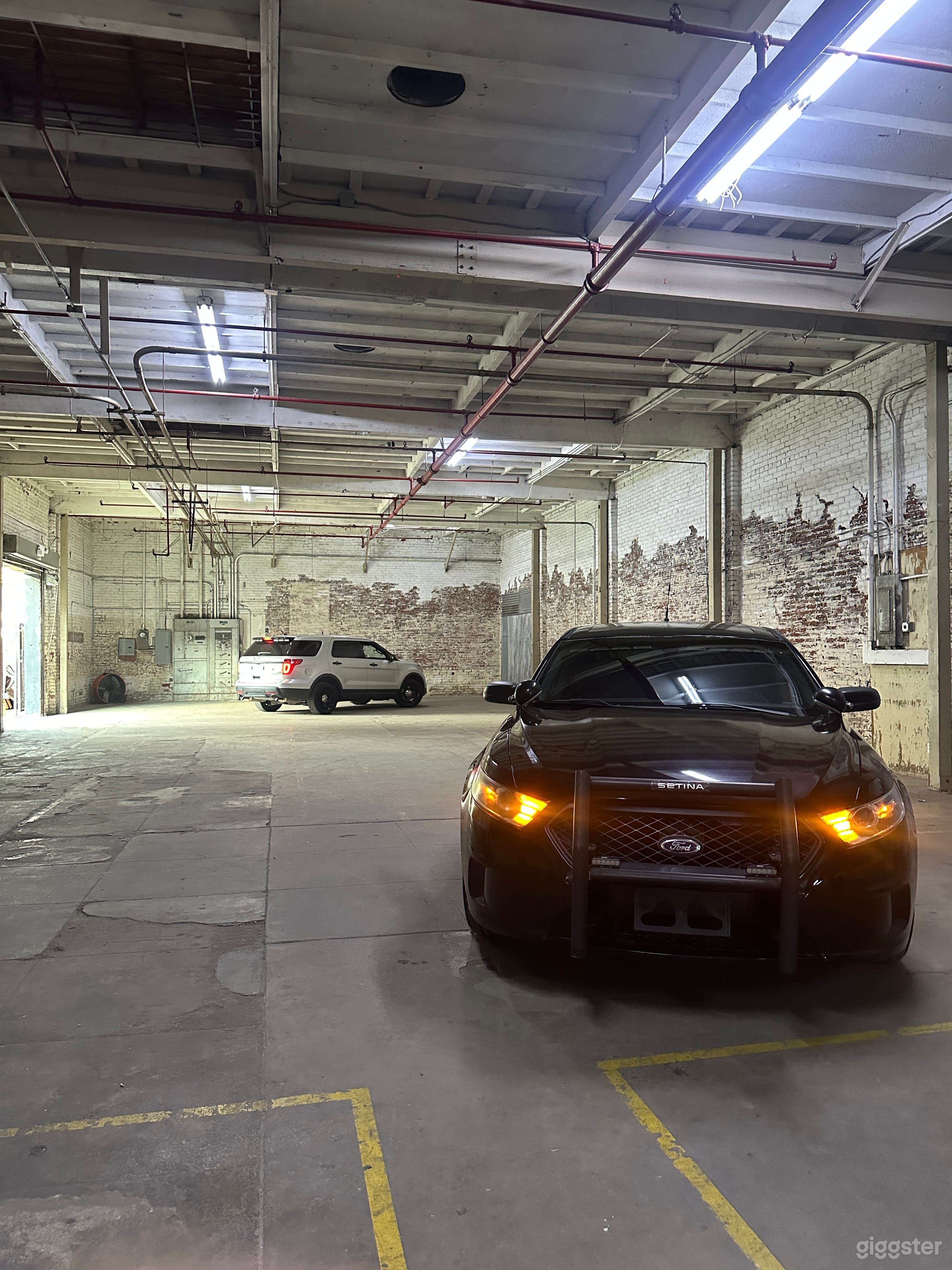 Parking lights on. SUV model shown in background (also available)