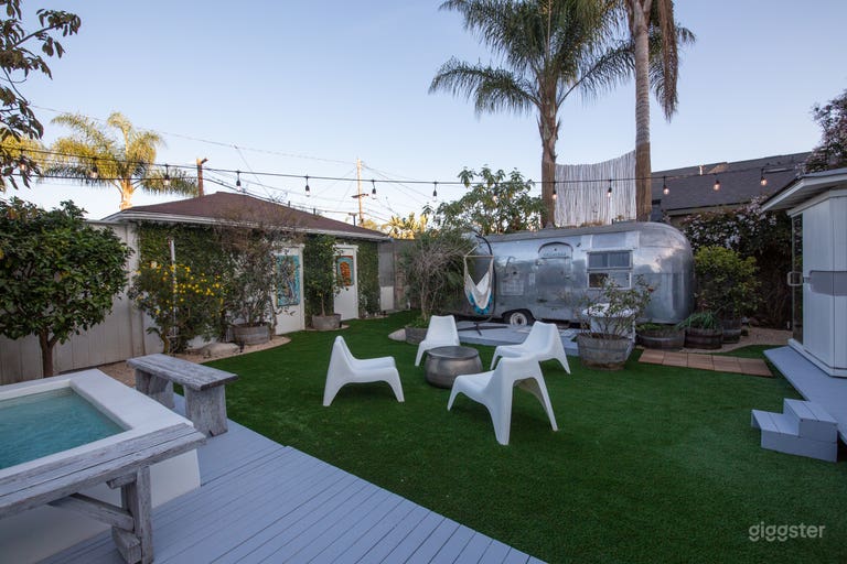  Soak up the sun amidst lush greenery and fruit trees in the backyard 