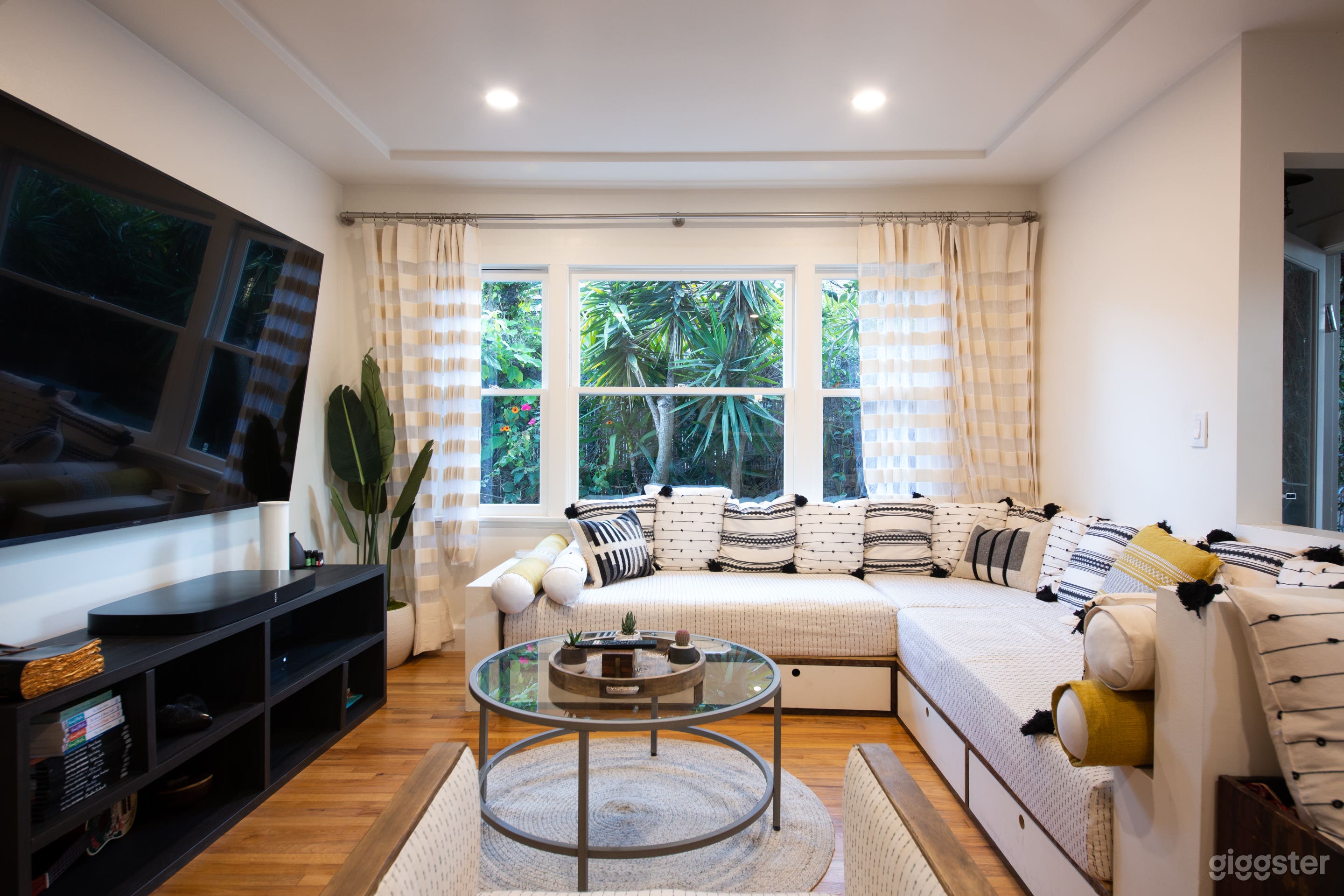 Our living room features a large and comfortable custom-designed deep-seated couch, chromotherapy lighting, and an 85" SMART TV that's Netflix connected. 