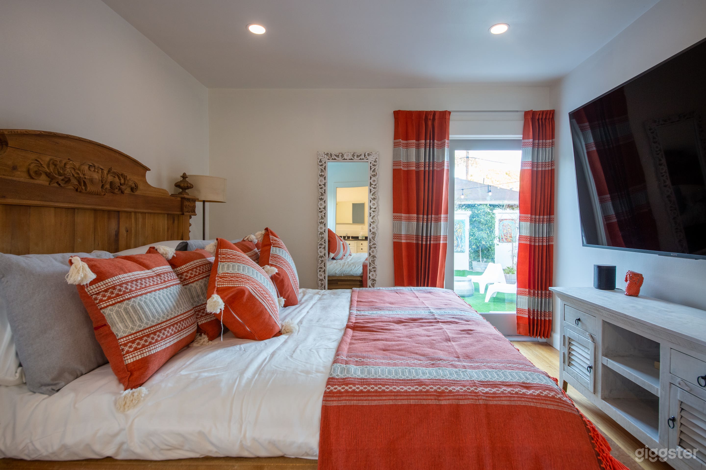 Spacious master bedroom with 75" SMART TV.