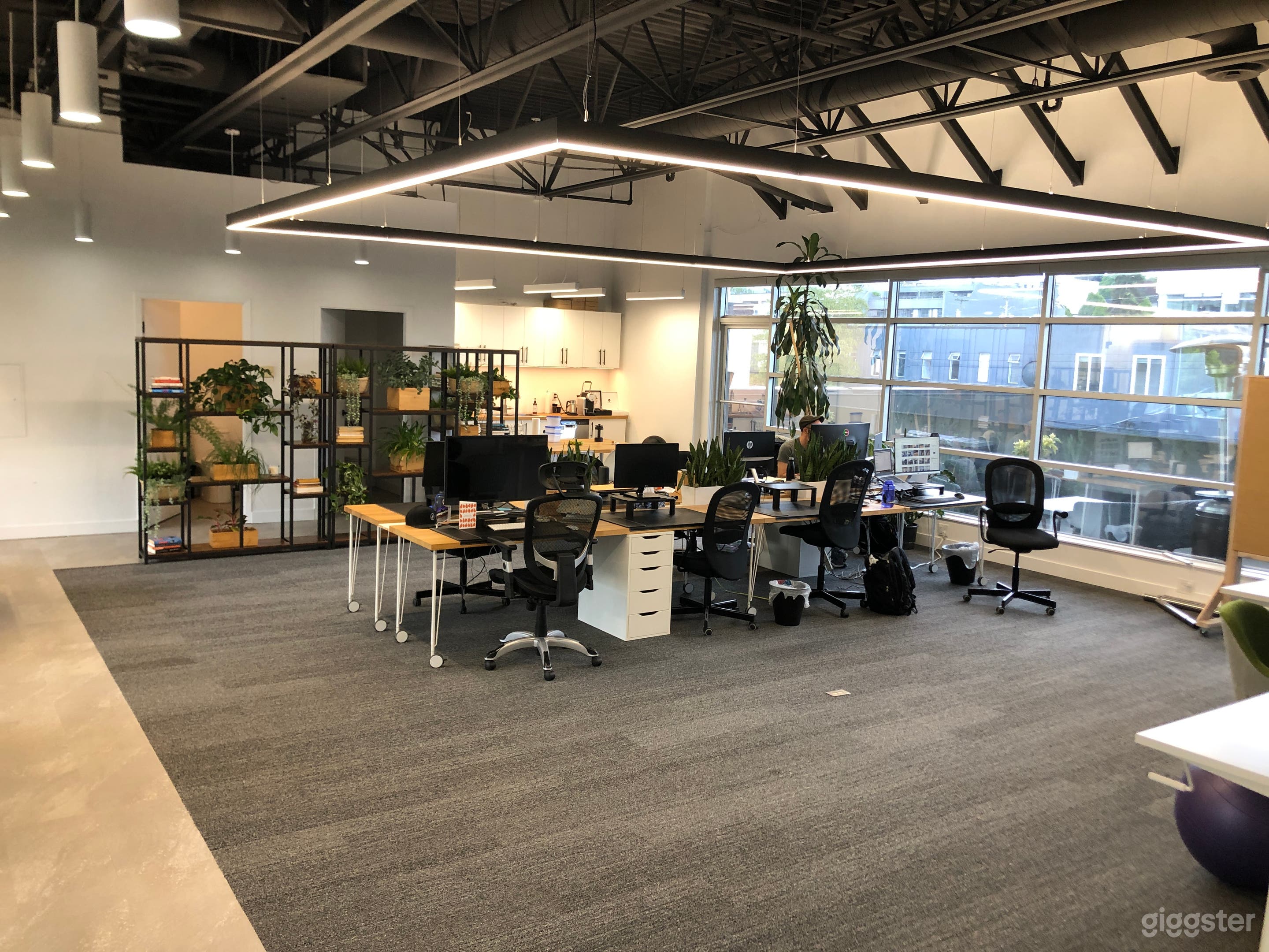 Open space with kitchen &amp; 2 bathrooms in the back corner.