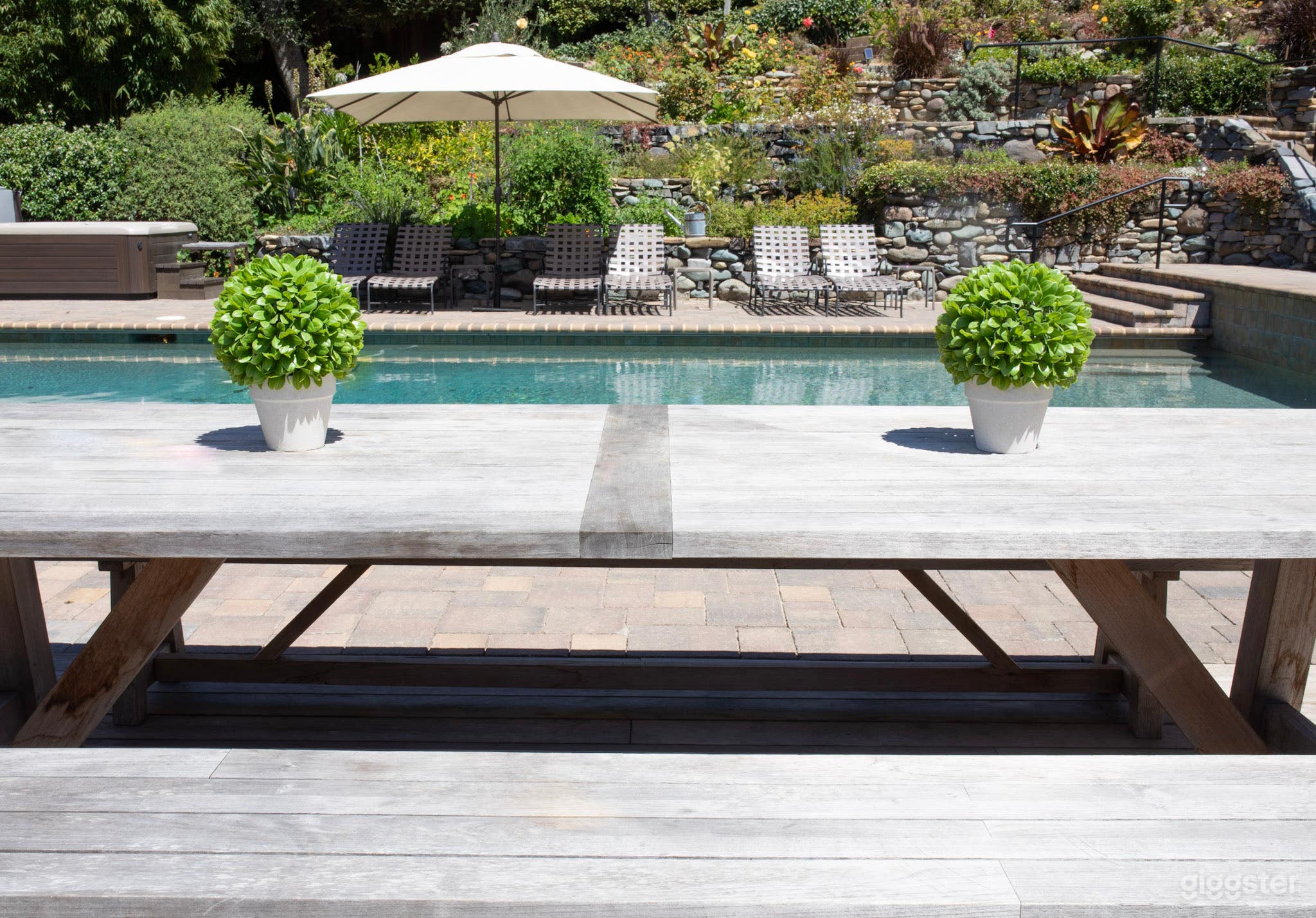 Featuring private grounds, large swimming pool, terraced gardens, fountains, fire pit, lounge area, ample dining and bbq