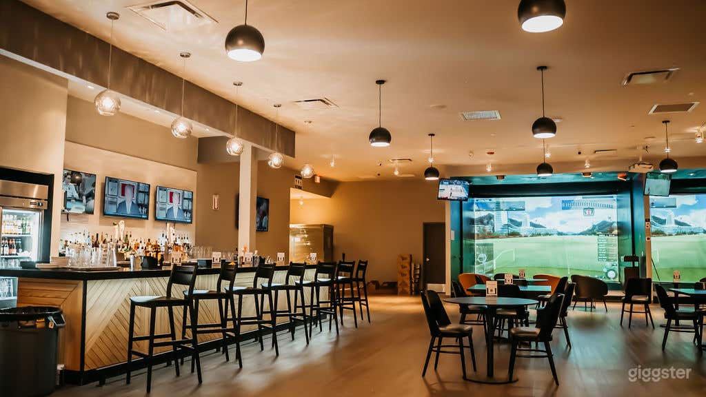 Modern Indoor Golf Simulator Facility Photo 4