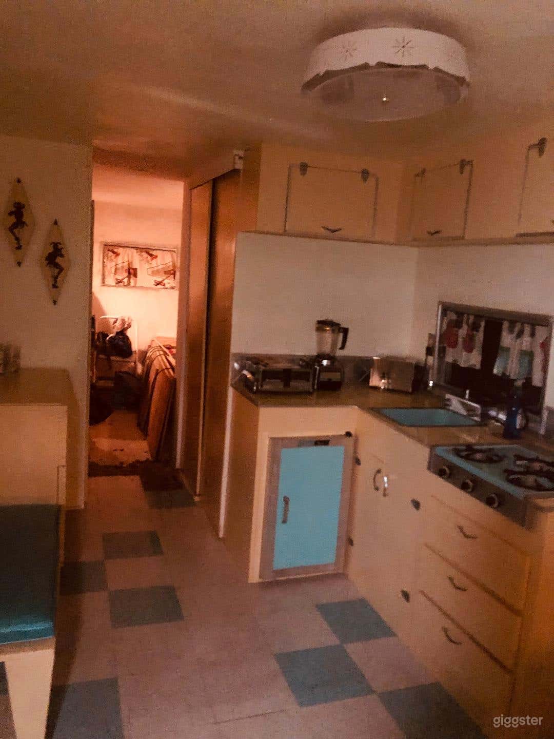 Kitchen area. Sink, fridge and stove function.