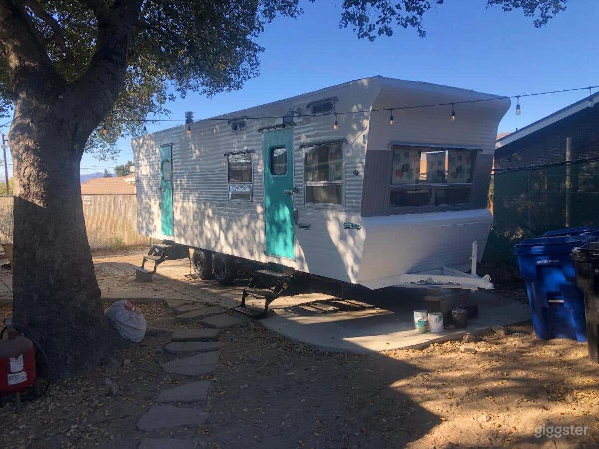 Entrance side and front of trailer. Has back and front door with steps. 