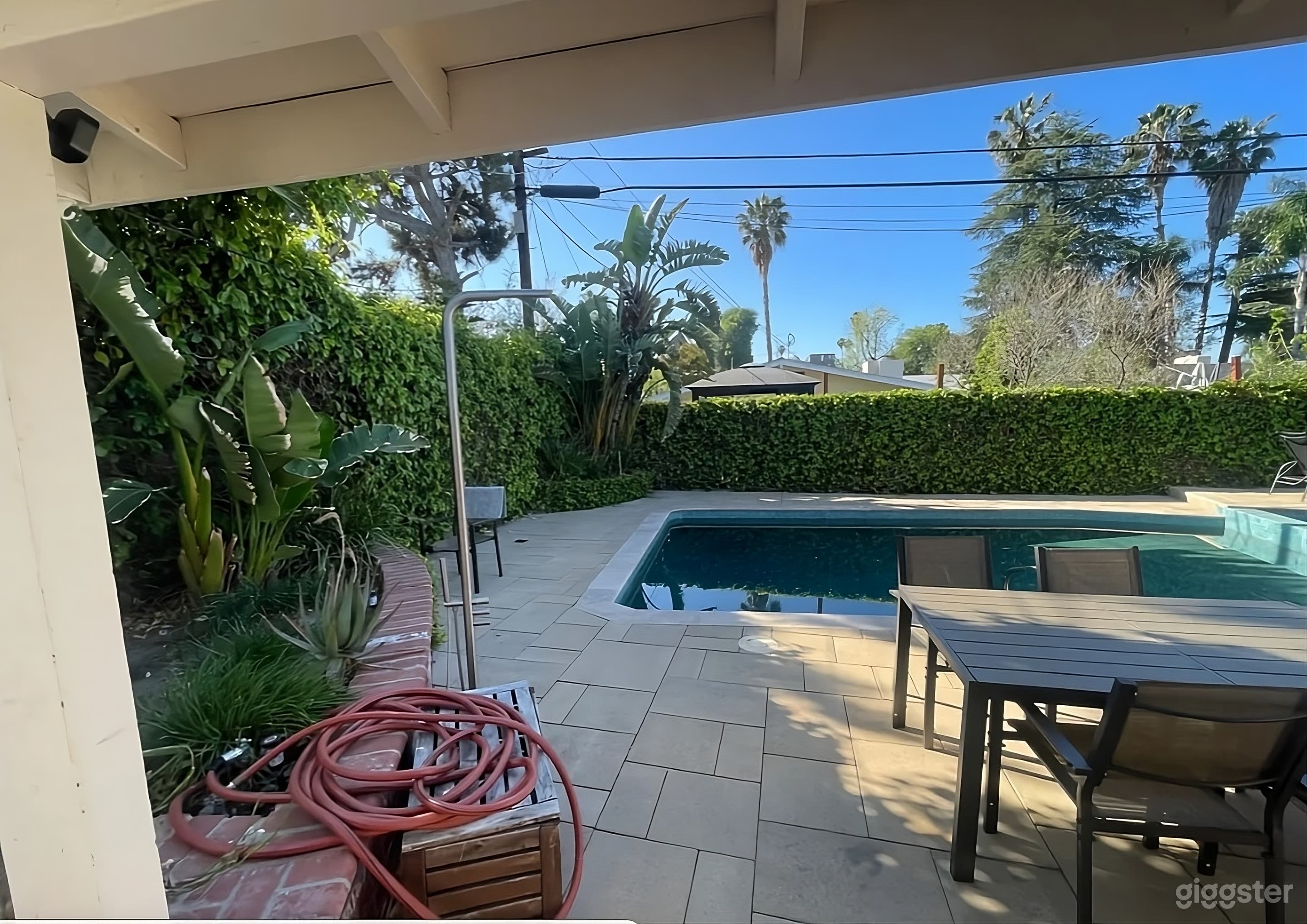 Lush Backyard with Pool and Game Area Photo 2