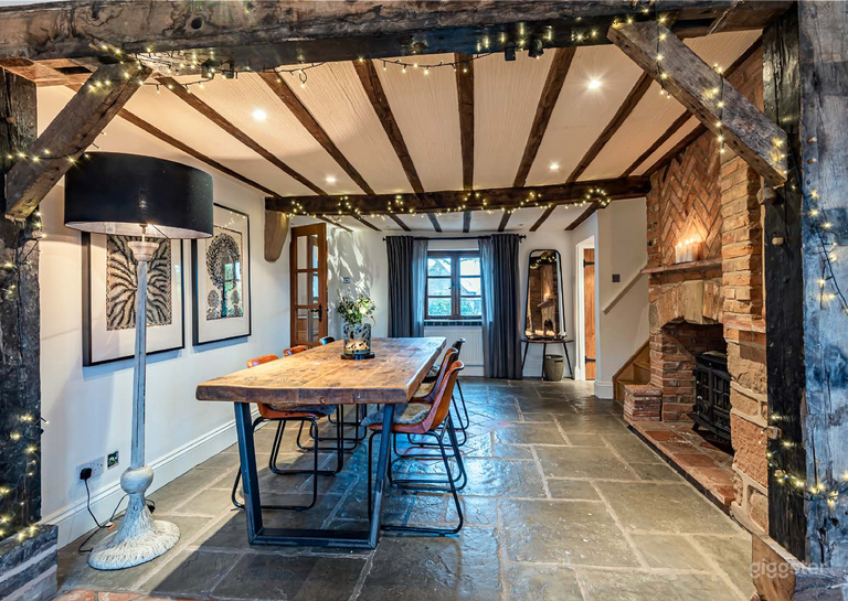  Entrance / Dining room - taken from the kitchen. One of the staircases to the right, meaning overhead photography is simple.  