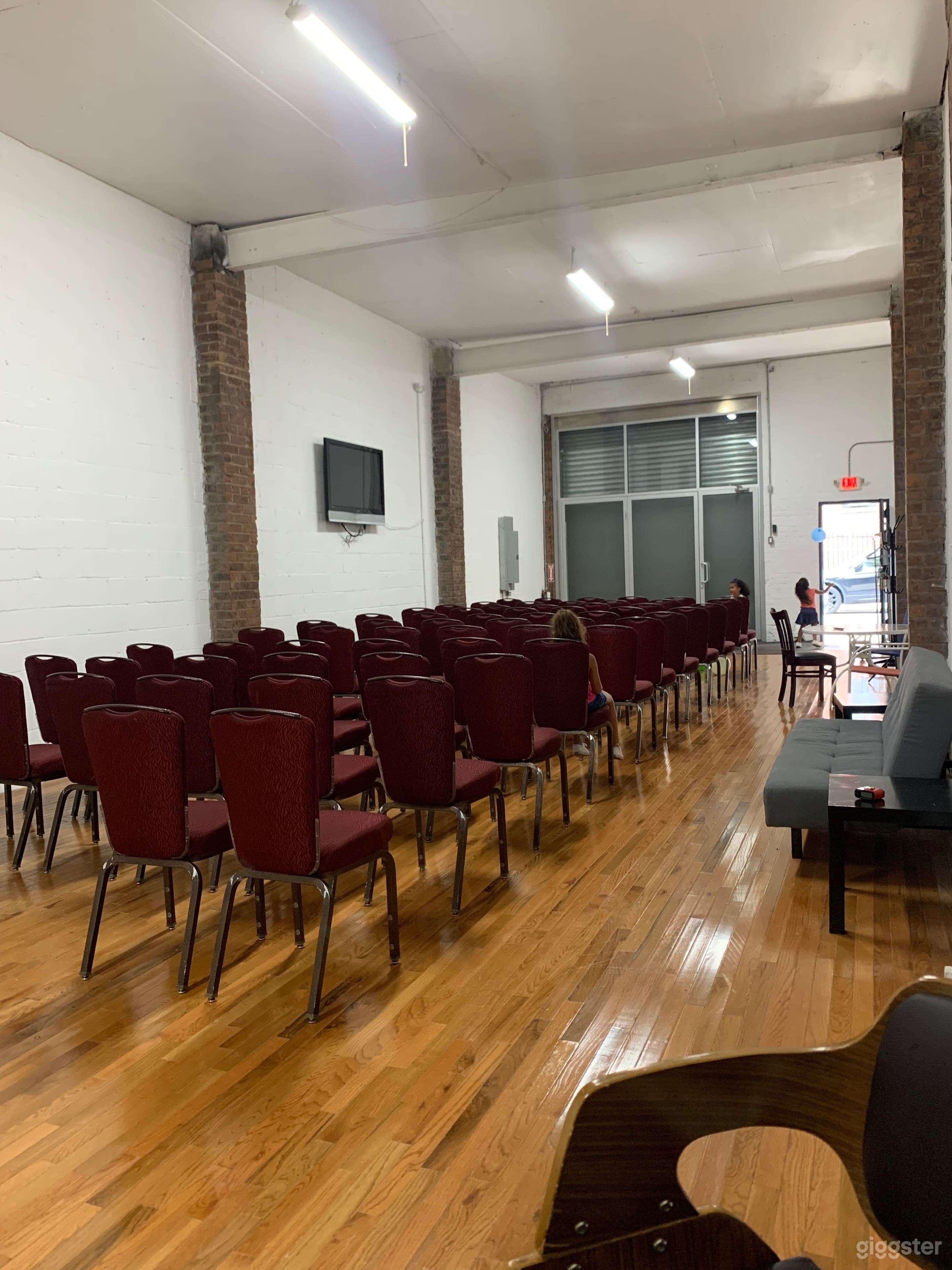 Raw multi-use space, exposed brick, high ceilings. Photo 3