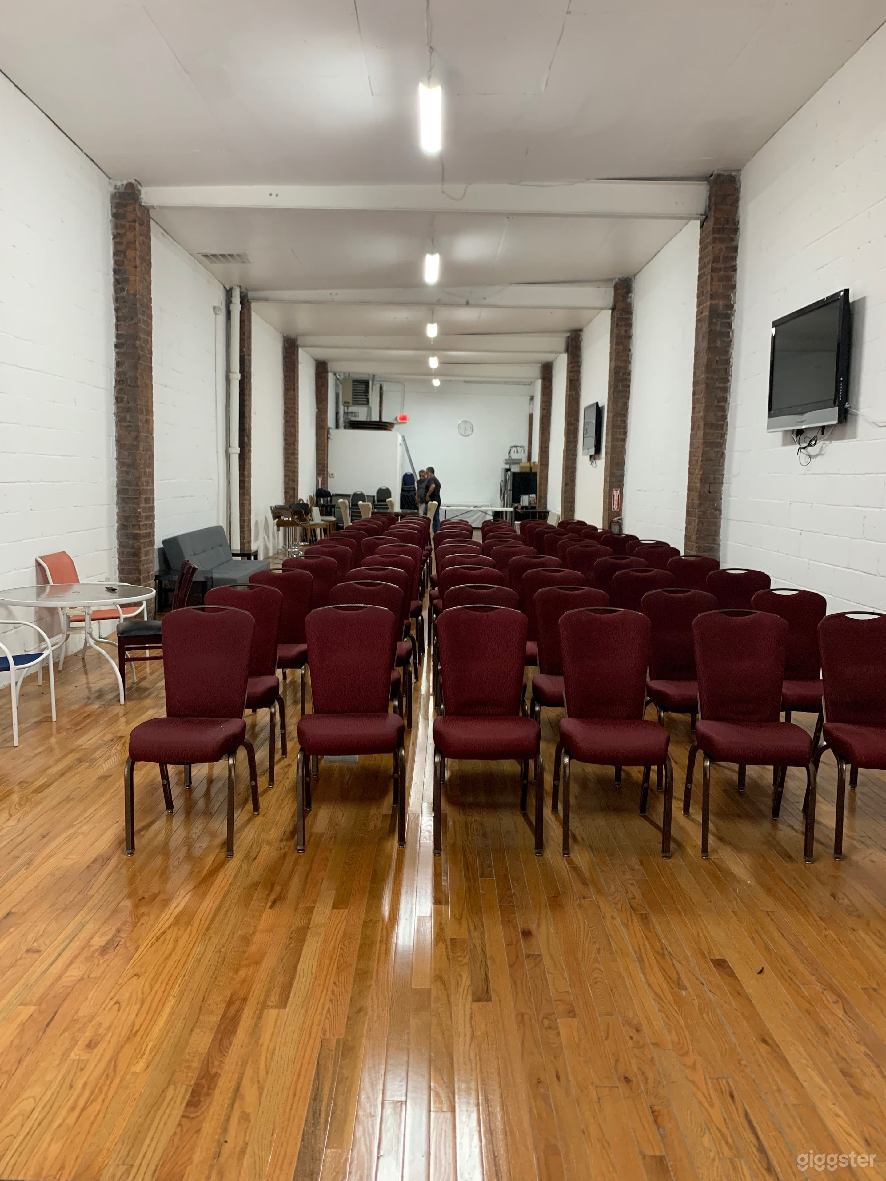 Raw multi-use space, exposed brick, high ceilings. Photo 2