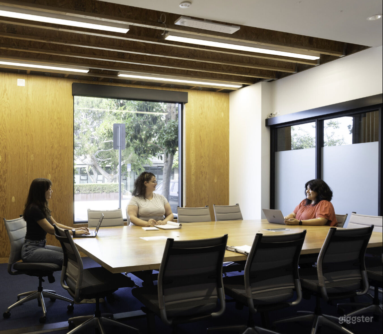  Large Conference Room with large tv, exterior and interior windows and a creative vibe 