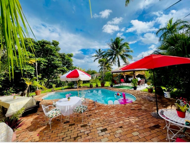   Tropical Poolside Oasis with Lush Garden 