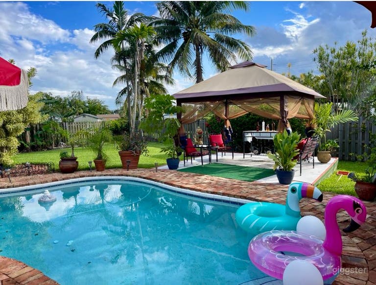   Tropical Poolside Oasis with Lush Garden 