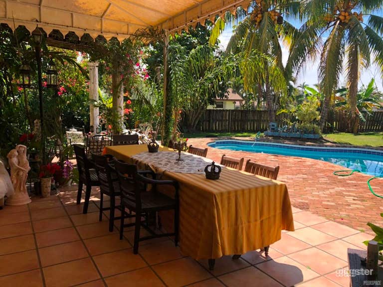   Tropical Poolside Oasis with Lush Garden 