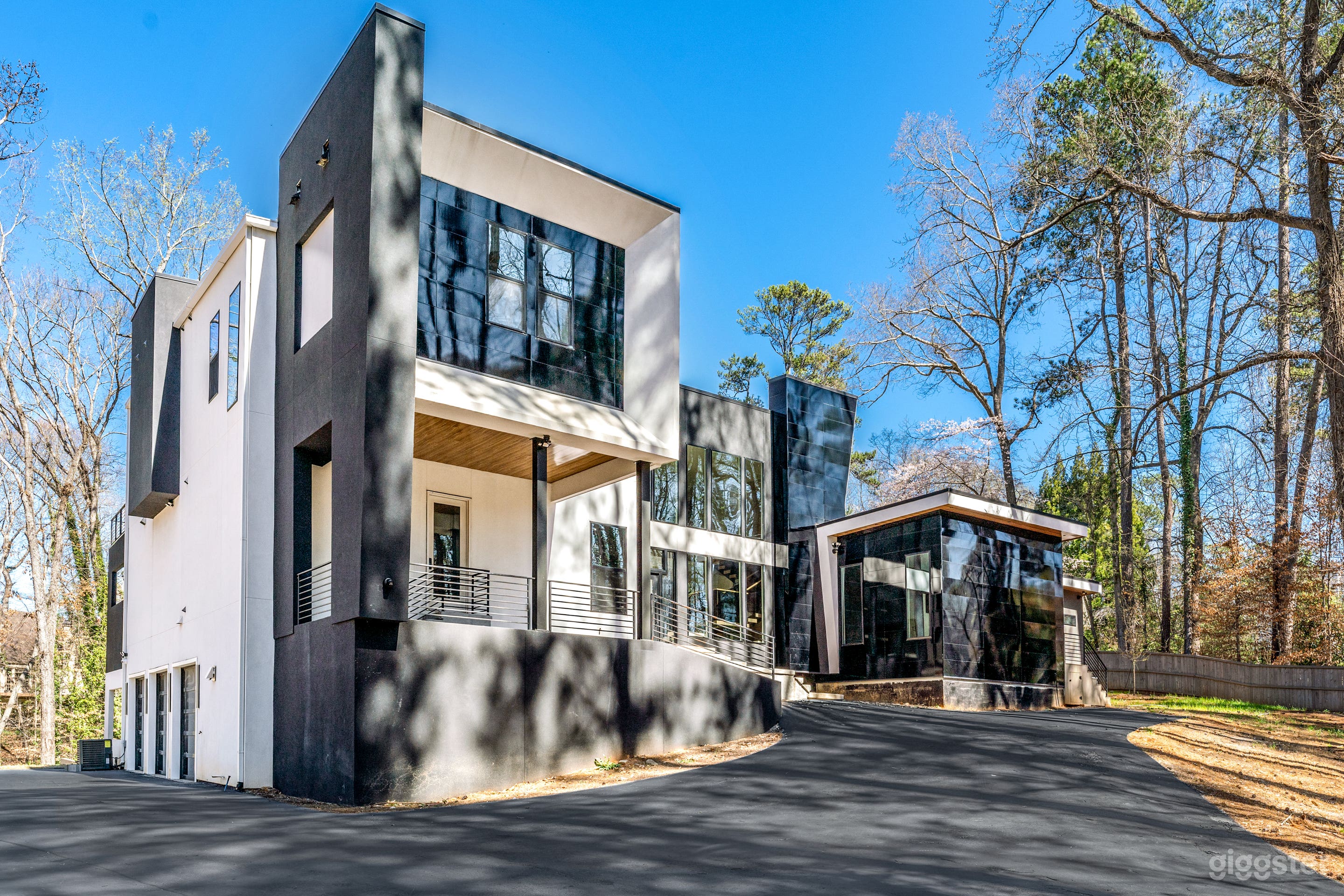 Exterior – Modern Mansion
Striking black and white modern architecture set on a private 2.37-acre lot in Buckhead. Surrounded by lush greenery, this secluded estate features clean lines, bold angles, and a long driveway—offering a cinematic backdrop.
