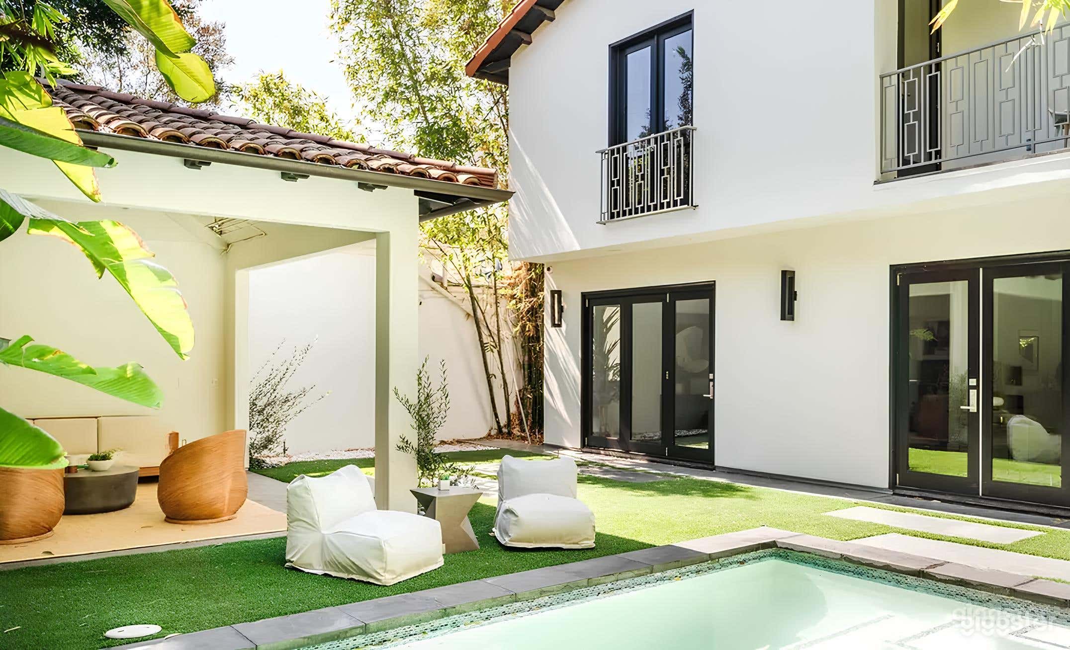 Spanish-Inspired Modern Backyard with Pool and Lounge Photo 4