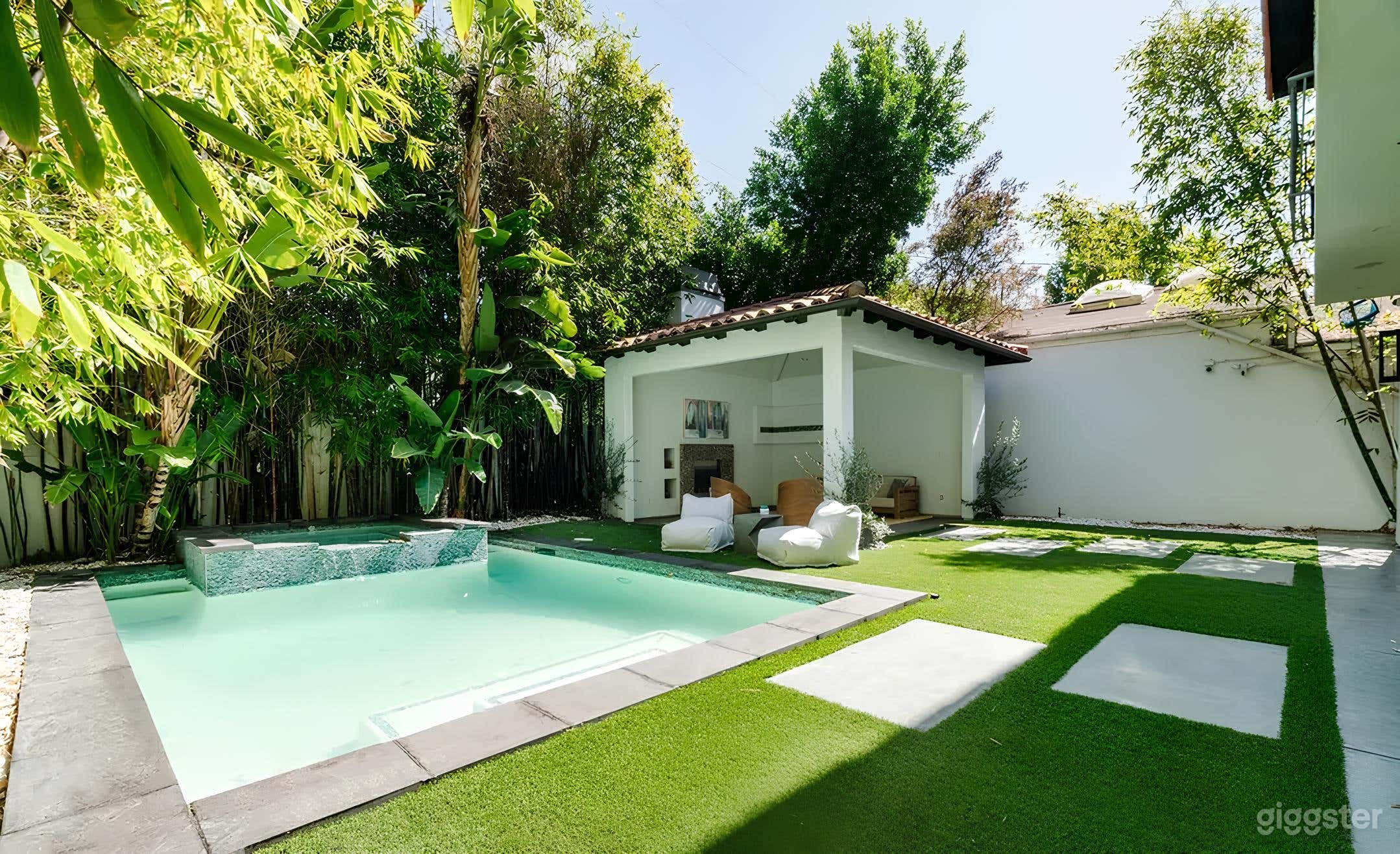 Spanish-Inspired Modern Backyard with Pool and Lounge Photo 1