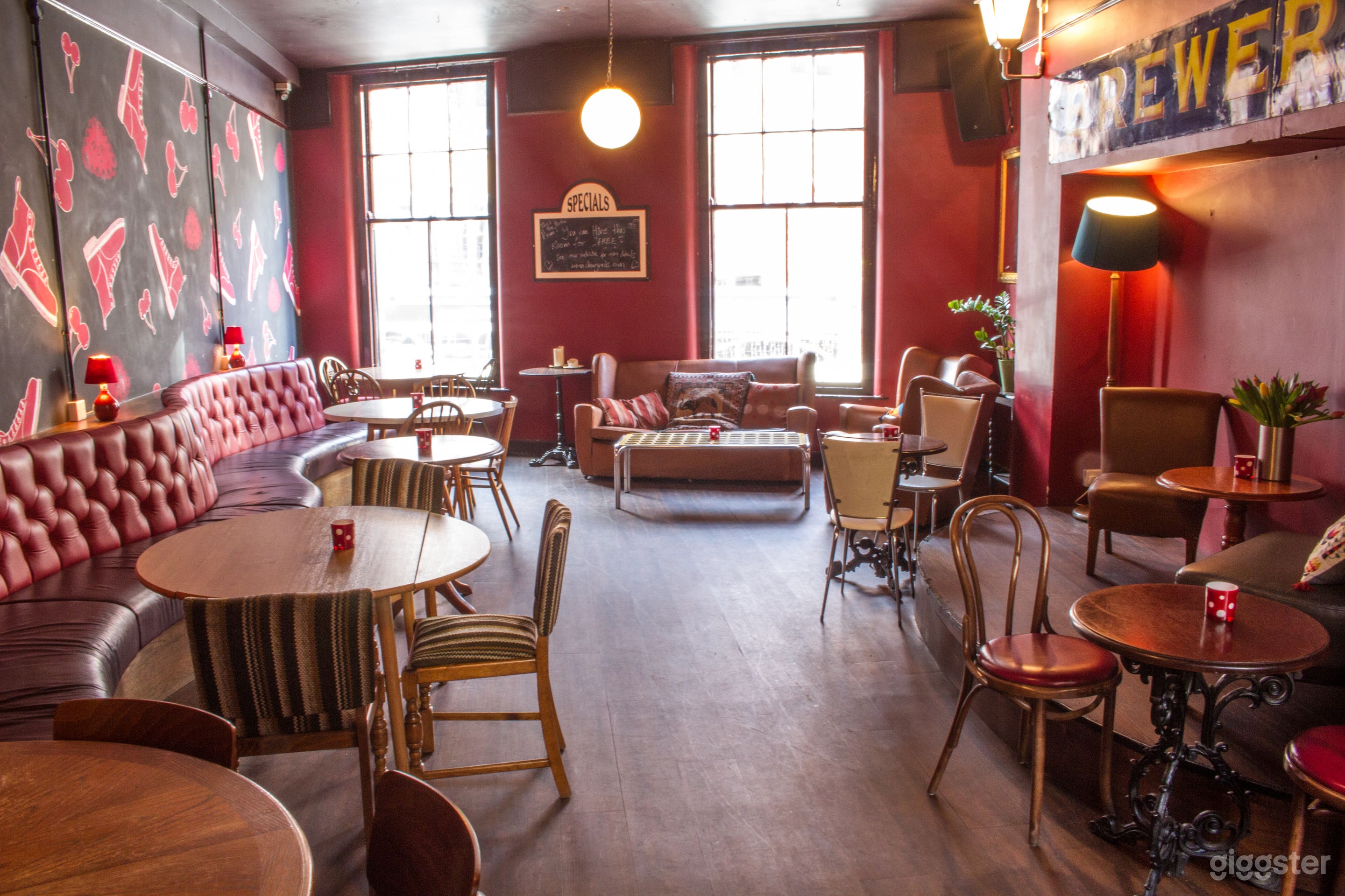 Larger private room upstairs with small stage and fixed seating