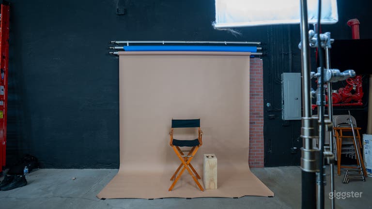  Mocha backdrop with film light, directors chair, apple box 