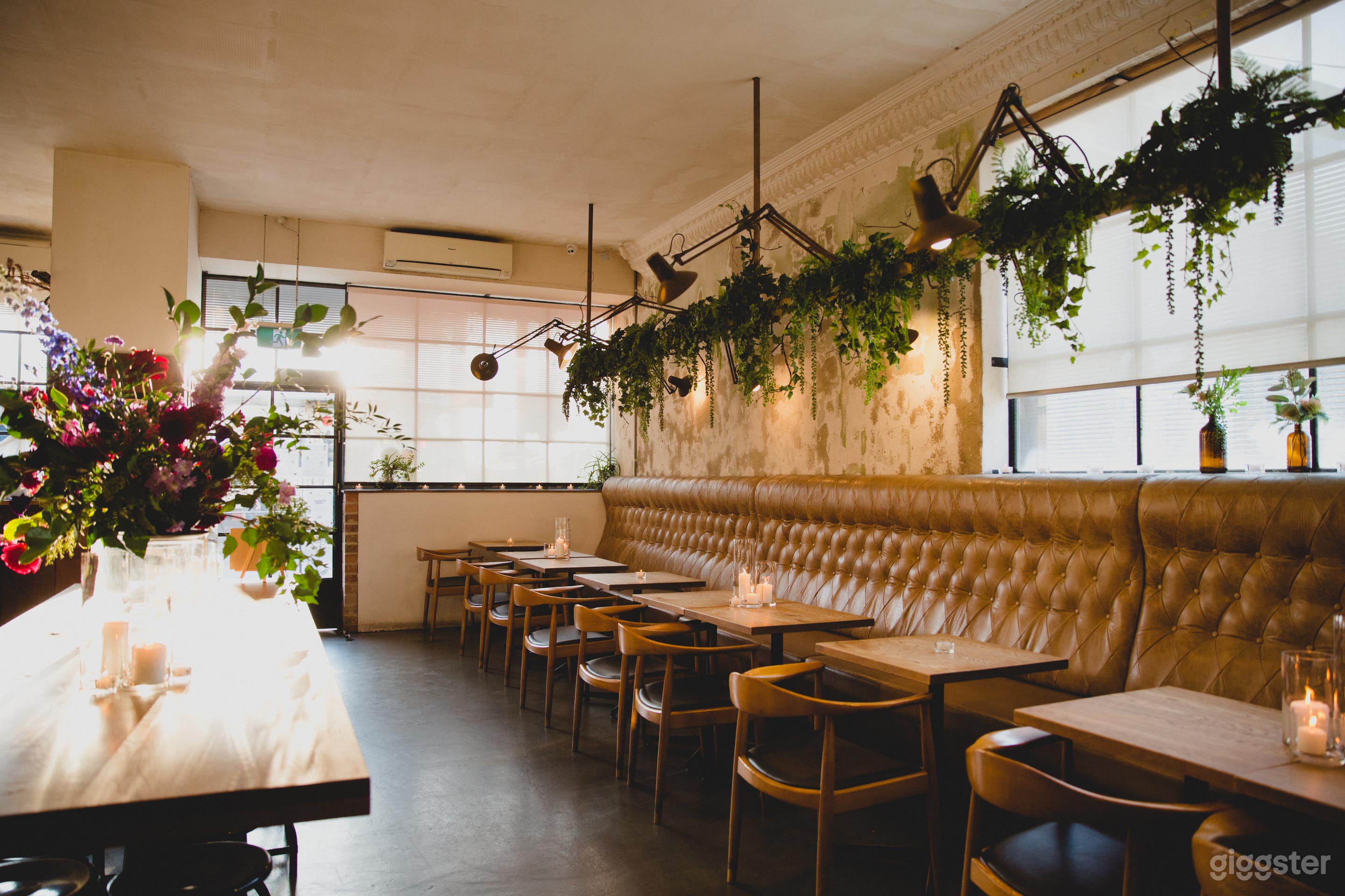 Leather lounge &amp; large grazing table inside the dining room