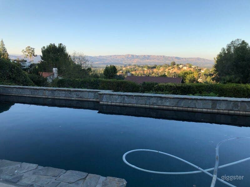 Stunning Poolside Retreat with Views Photo 3