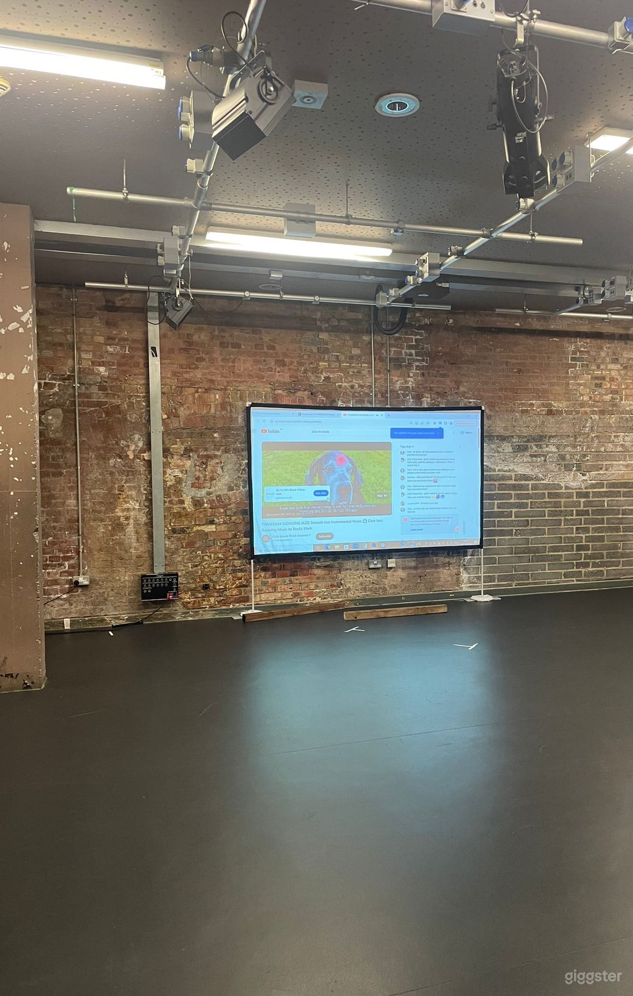 Back Wall of basement Studio. Projector screen can be removed.