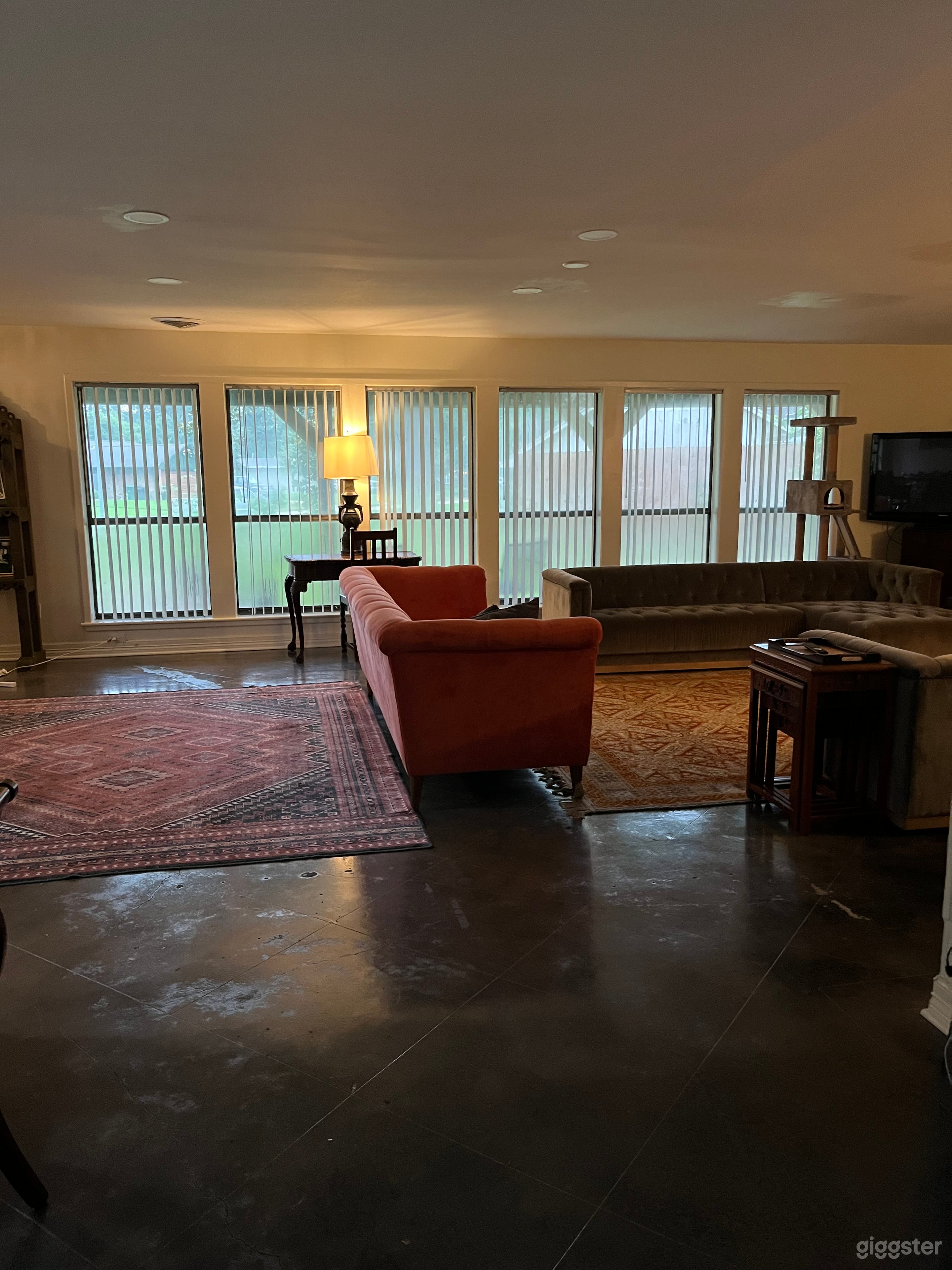 Huge open plan living - dining - kitchen area with large windows - assortment of sofas and rugs -all can be moved/rearranged