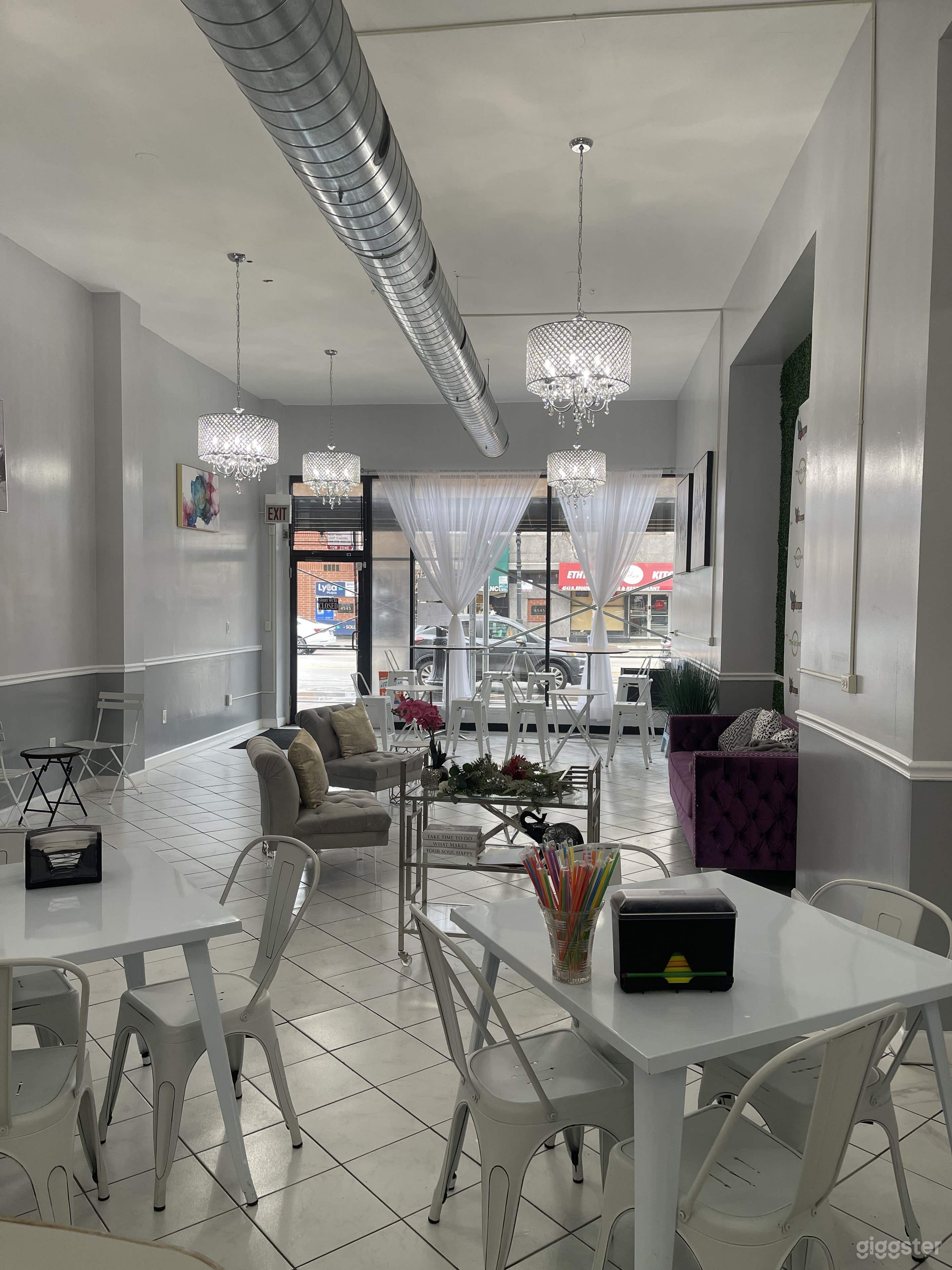 This is a daytime view from the bar area with chandeliers.