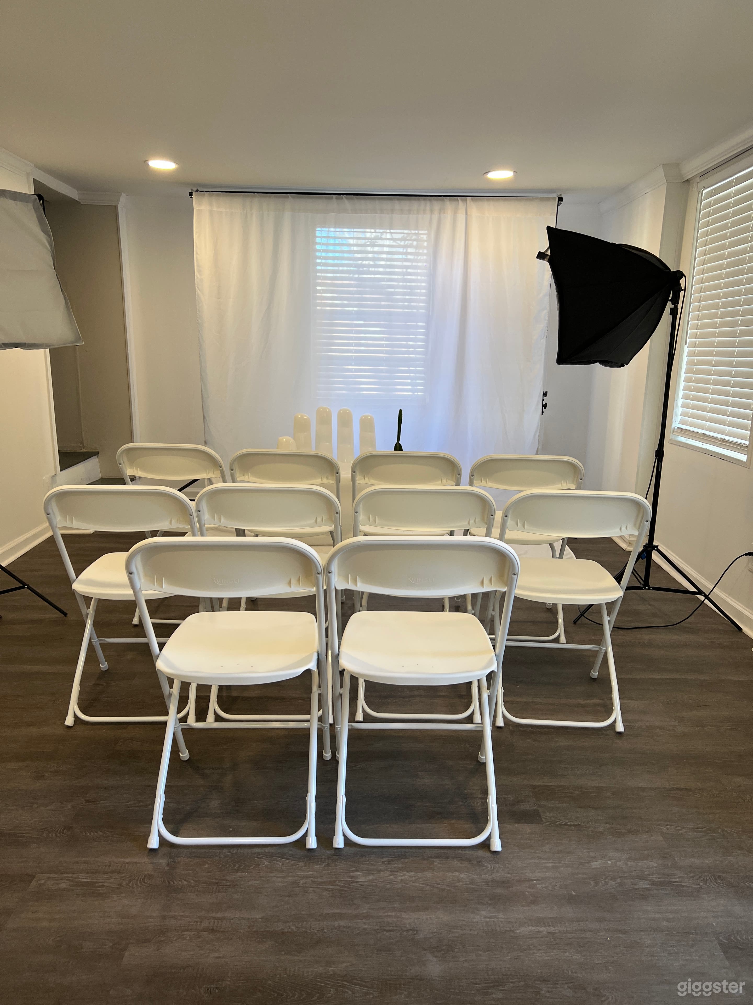 Basement photo + content studio. Crew holding seating.