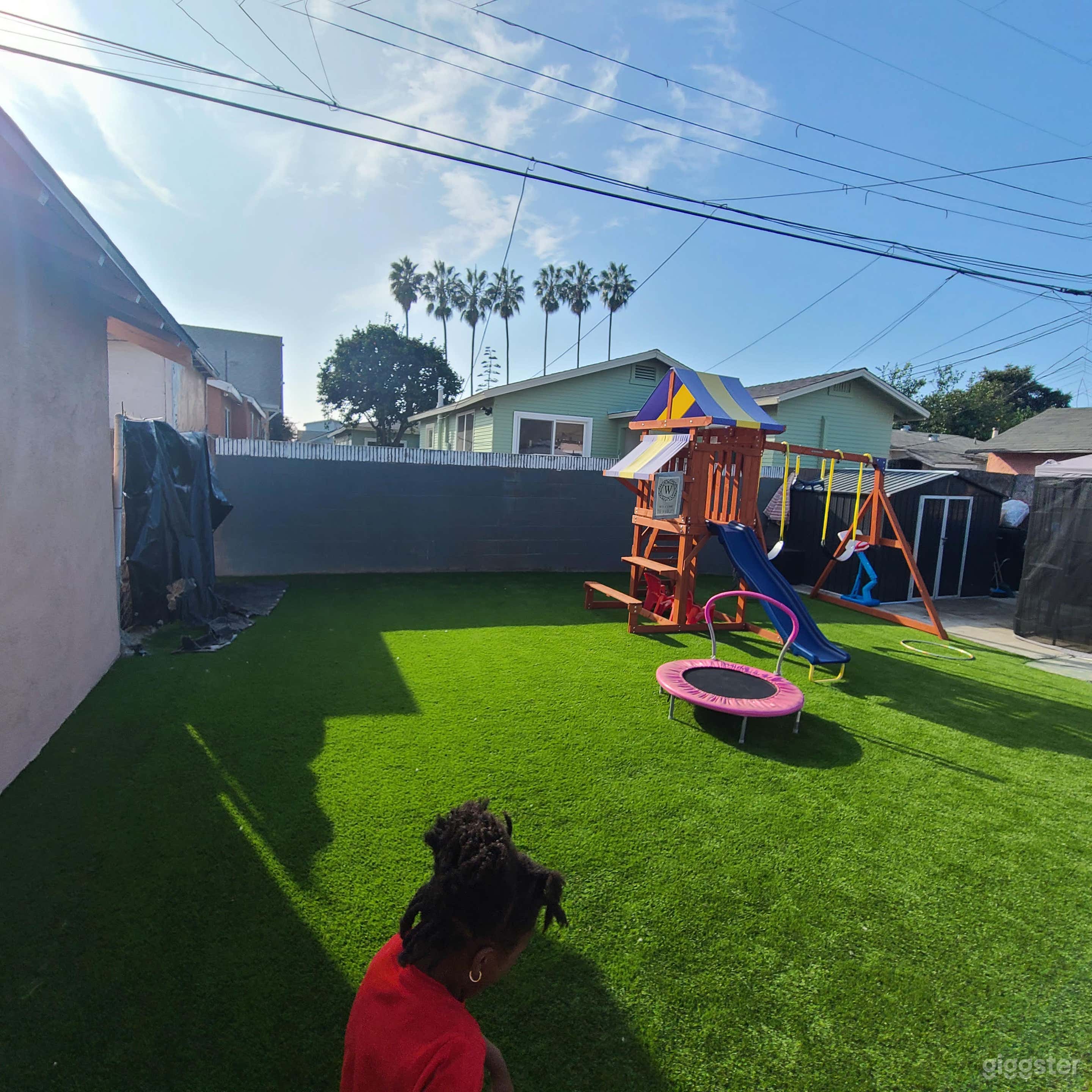 Vibrant Backyard with Playset and Patio Photo 4