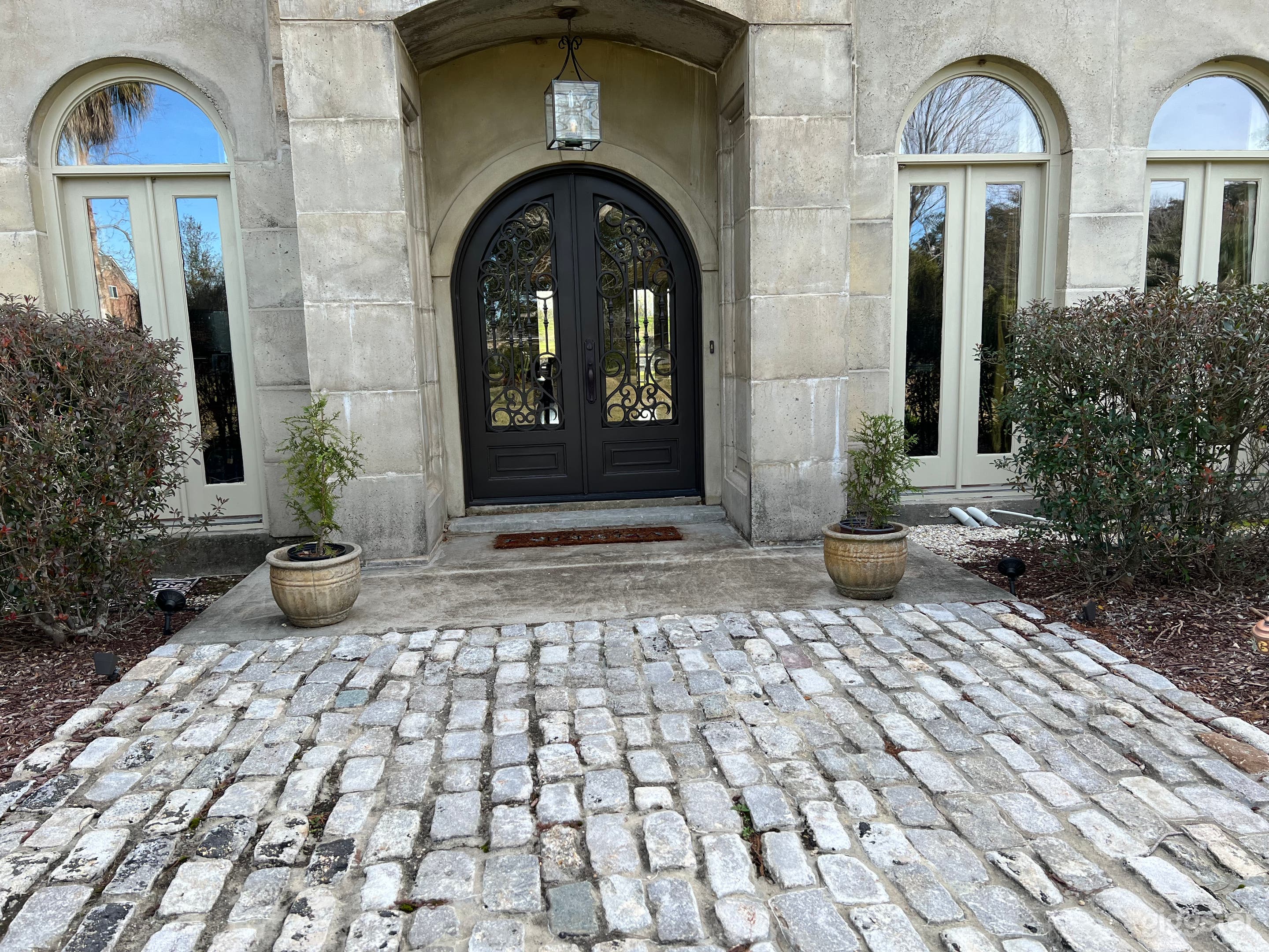 Main entrance with cobblestone from an old New Orleans Street