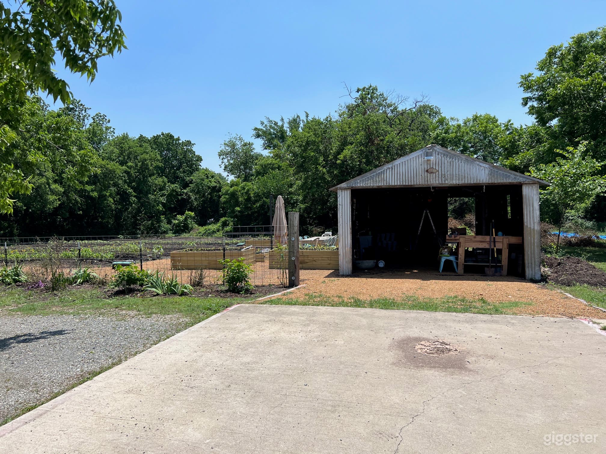 old metal rustic open detached garage that we use for storage, we will be updating and adding a farm table inside soon with chairs