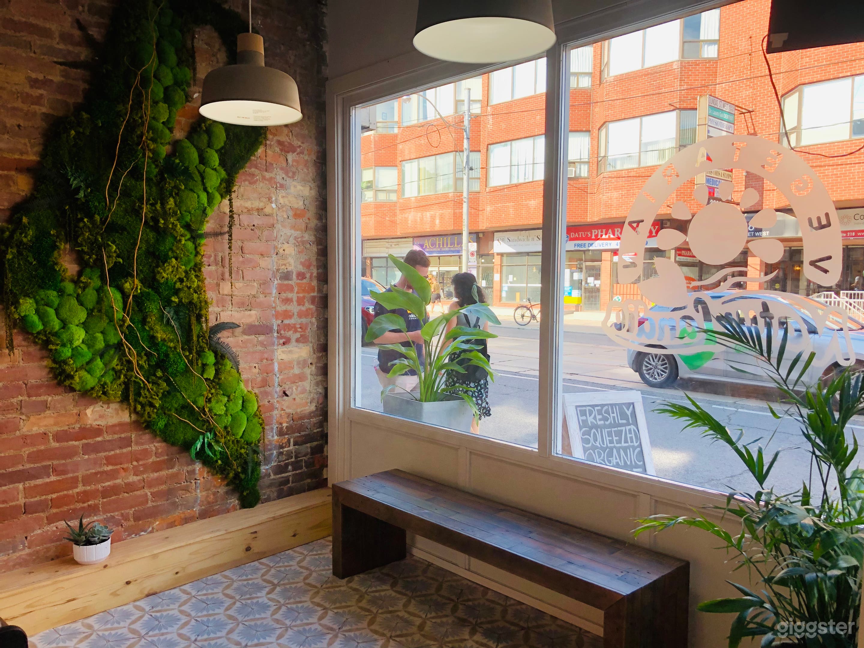 storefront juice shop moss wall 