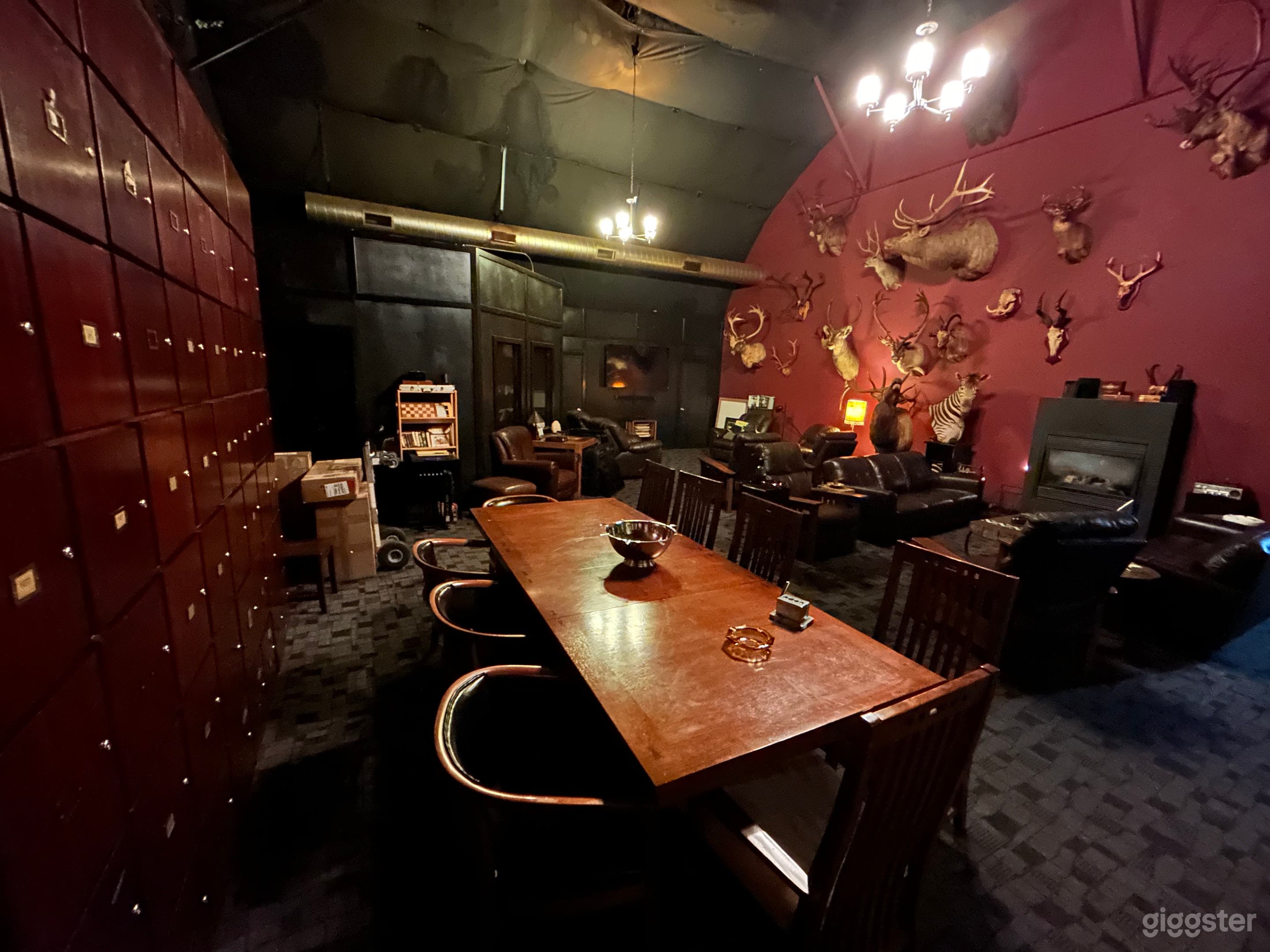 700 sq ft VIP speakeasy cigar lounge, 10 person dining table, sofas, easy chairs, fireplace, Hunting trophy wall